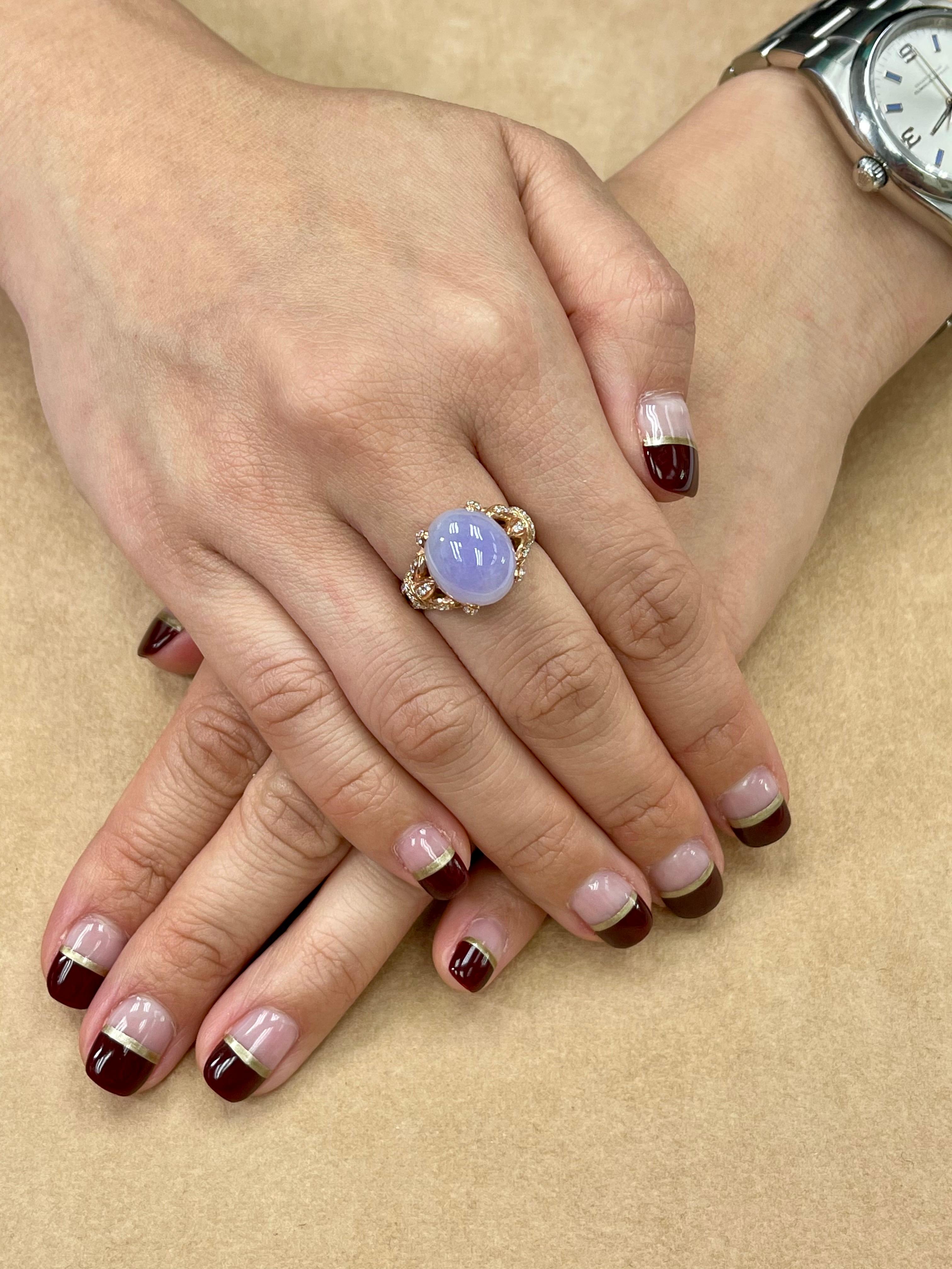 Here is a certified natural lavender purple jadeite Jade diamond cocktail ring. The ring is set in 18k rose gold and diamonds. There are 0.54 cts of diamonds in this setting. The setting is unique. The center of attention is the untreated and