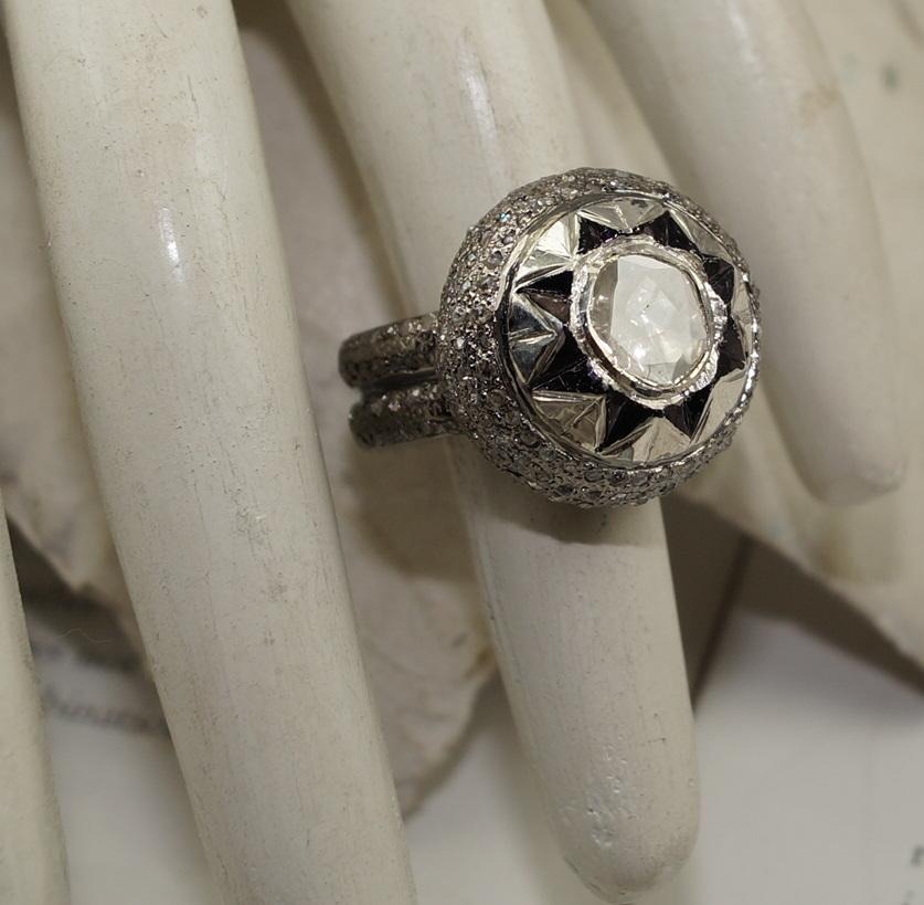 This is a beautiful antique style sterling silver ring. Crafted by fine artisans, it has 3.24ct diamonds. The ring has natural earth mined diamonds. The ring stands out for its classy look. It has diamonds all aroung the band. The hand carving of