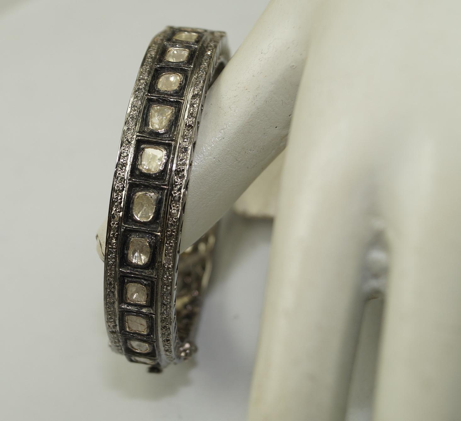 Step into a world of timeless elegance with this exquisite Victorian-inspired diamond bracelet. This stunning hinged bangle is a true masterpiece, meticulously crafted to evoke the grandeur and sophistication of the Victorian era.

The bracelet
