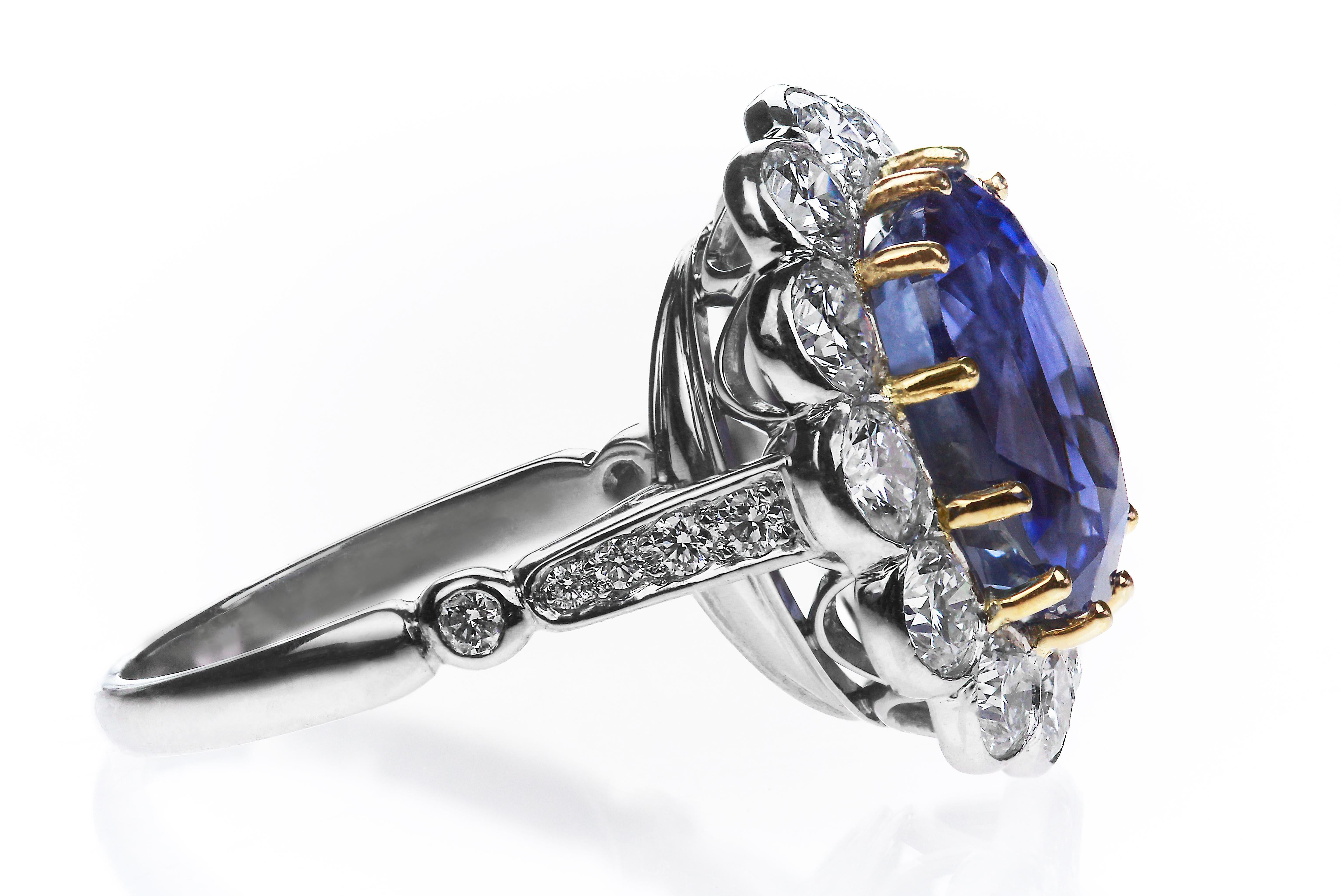 Certified natural untreated sapphire 9.22 ct and diamond ring set in platinum and yellow gold claws to complement the sapphire. 
Exquisite sapphire hue of blue perfectly complements shining diamonds. Cushion cut sapphire 9.22 carats with certificate