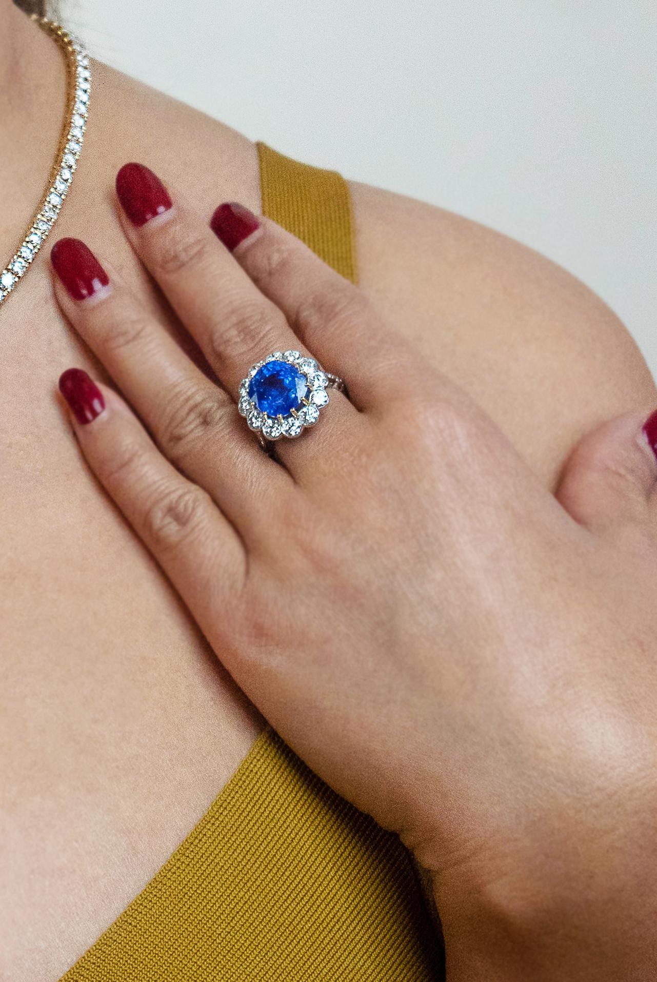Certified natural untreated sapphire 9.22 ct and diamond ring set in platinum and yellow gold claws to complement the sapphire. 
The exquisite sapphire hue of blue perfectly complements shining diamonds. Cushion cut sapphire 9.22 carats with a