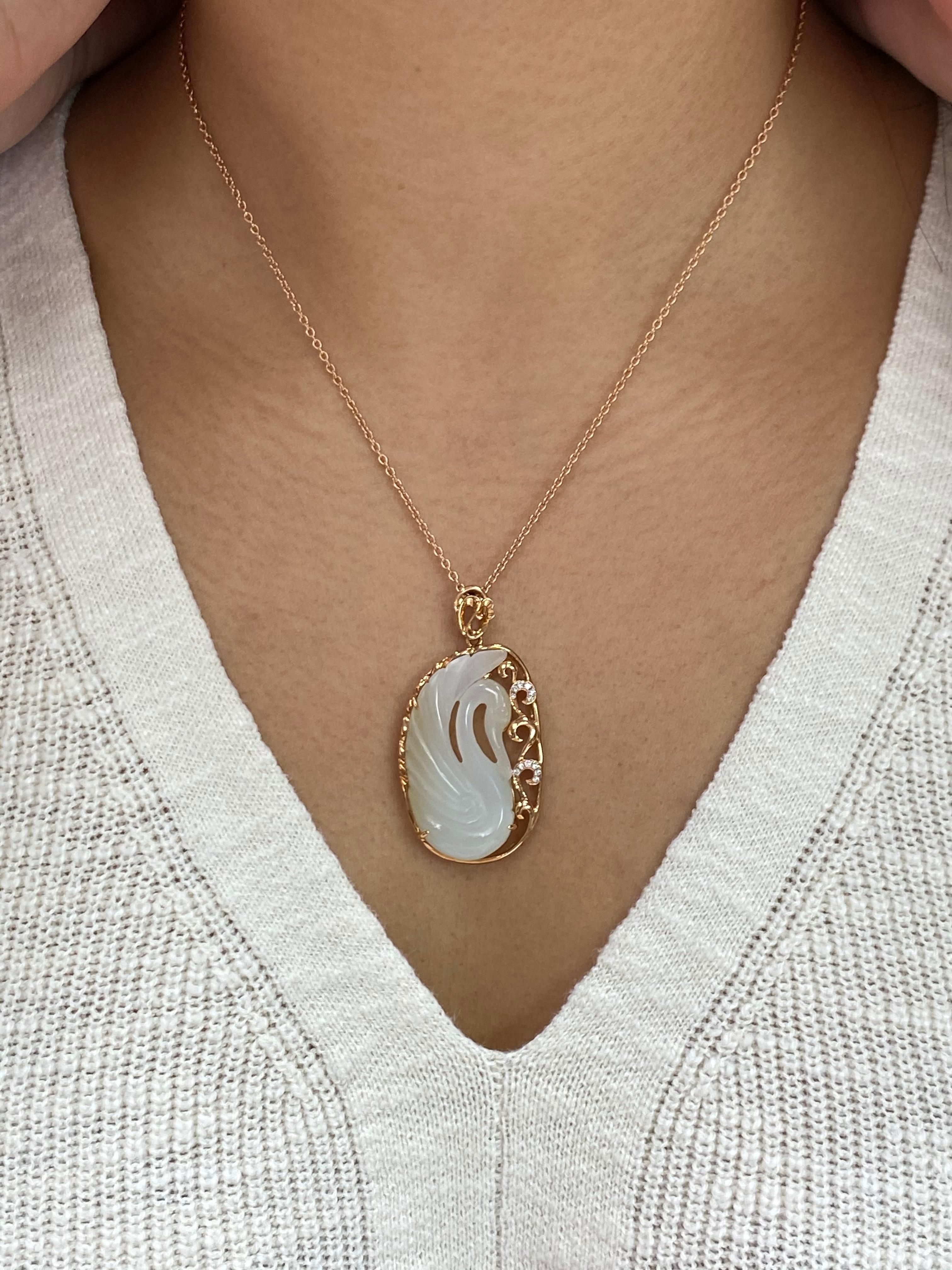 For your consideration is a certified natural nephrite white jade drop necklace. This jade swan is very well carved with excellent depth of field. The swan jade carving is encased in a beautiful diamond and rose gold setting. 12 diamonds totaling