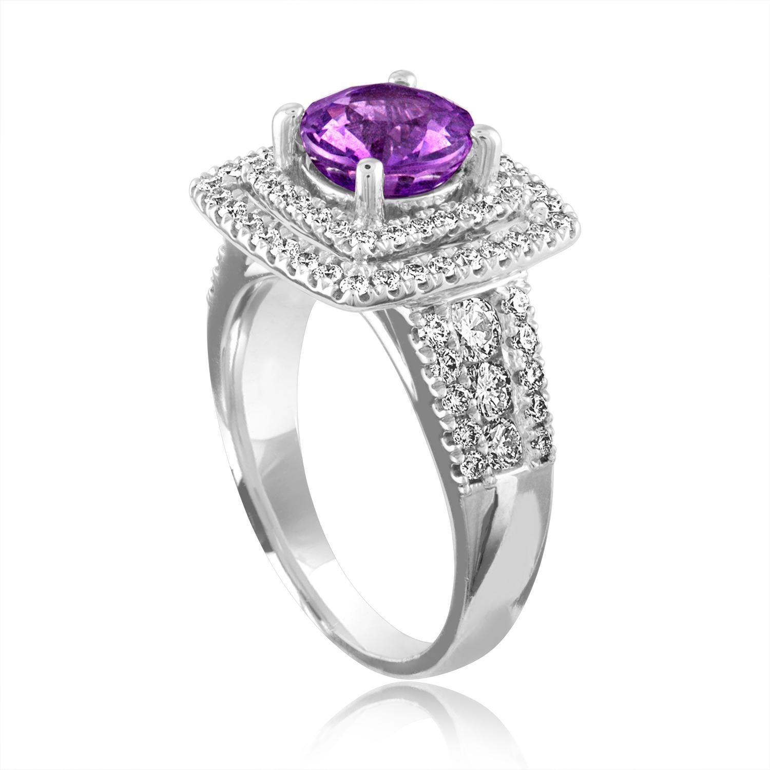 Exquisite Sapphire Surrounded by Double Diamond Halo
The ring is 18K White Gold
The Round Sapphire is Pinkish Violet 1.97 Carats
The Sapphire is Certified By LAPIS NO HEAT
There are 1.25 Carats in Diamonds F/G VS/SI
The ring is a size 6.00,