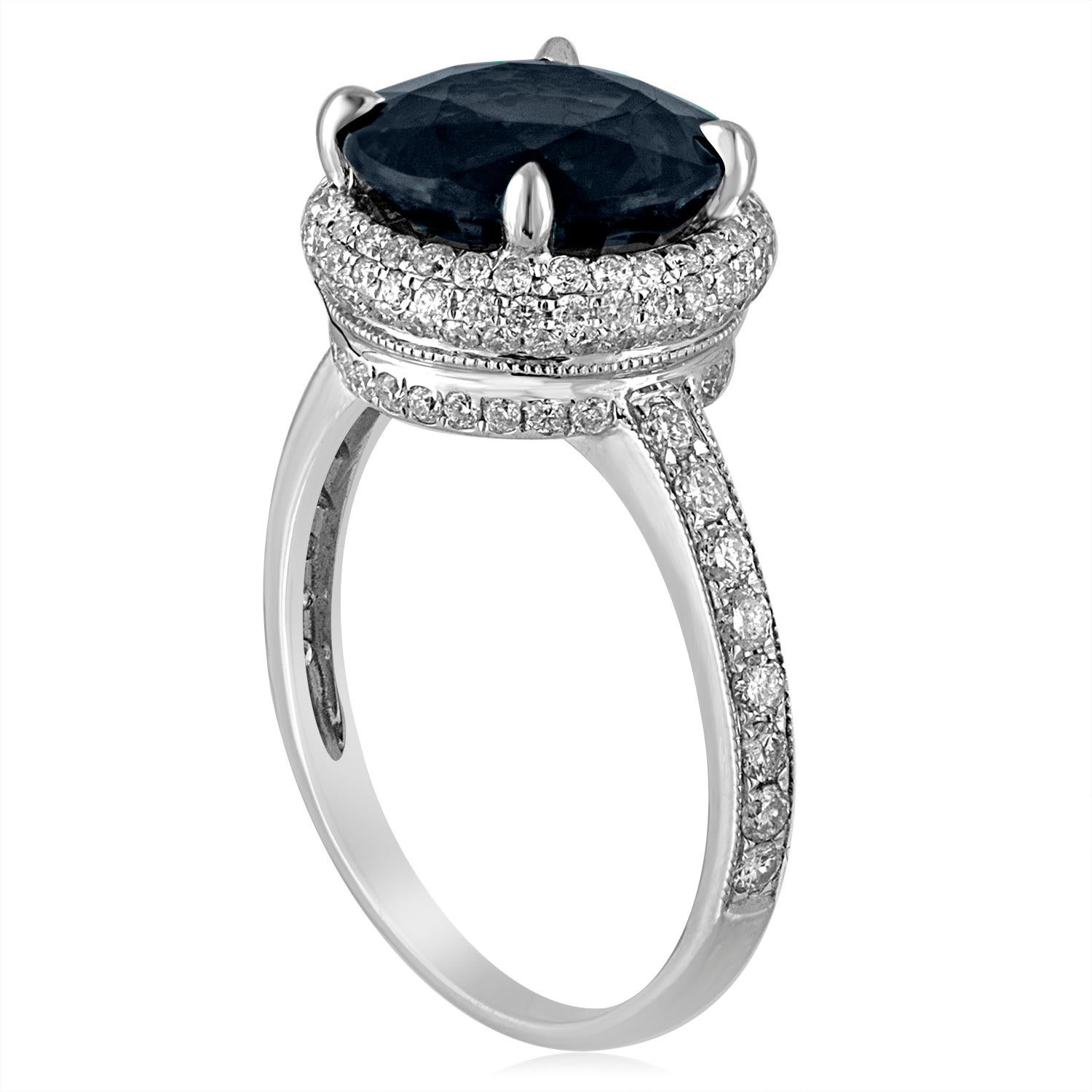 One-Of-A-Kind Sapphire Ring.
The ring is 18K White Gold.
There are 0.91 Carats in Diamonds F/G VS/SI.
The center stone is 4.98 Carat Round Greenish Blue (Teal) Sapphire.
The sapphire has NO HEAT and is certified by LAPIS.
Natural Inclusions inside