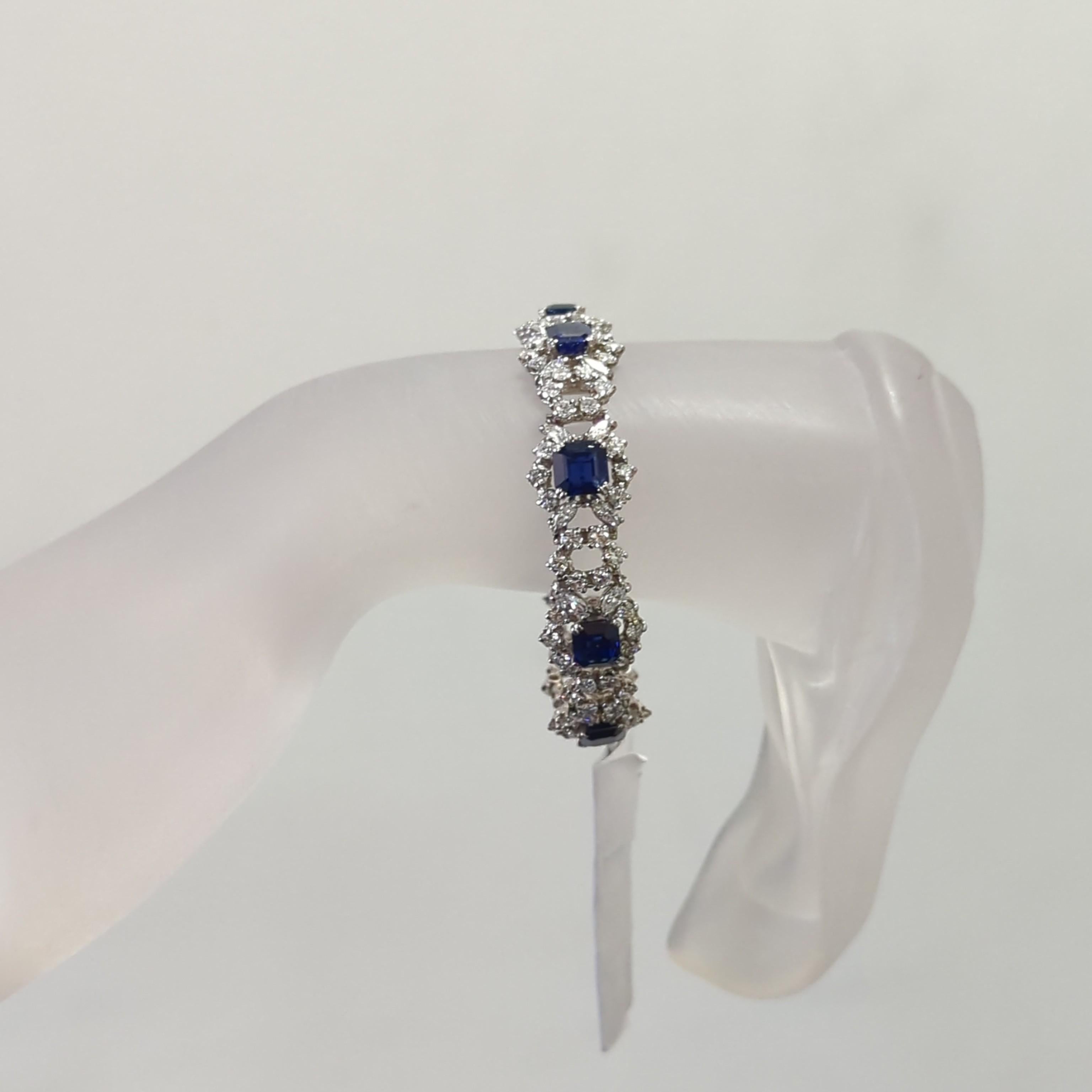 Gorgeous 12.50 ct. bright blue sapphire octagon shapes (8 total stones) with good quality white diamond marquise and rounds.  Handmade in platinum.  This bracelet is a great addition to any fine jewelry collection and a wonderful investment piece. 