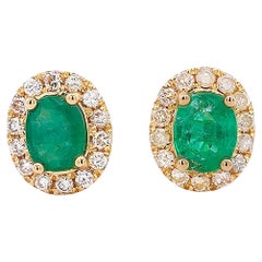 Certified Oval Cut Emerald & Diamond Halo Stud Earring in 14K Gold