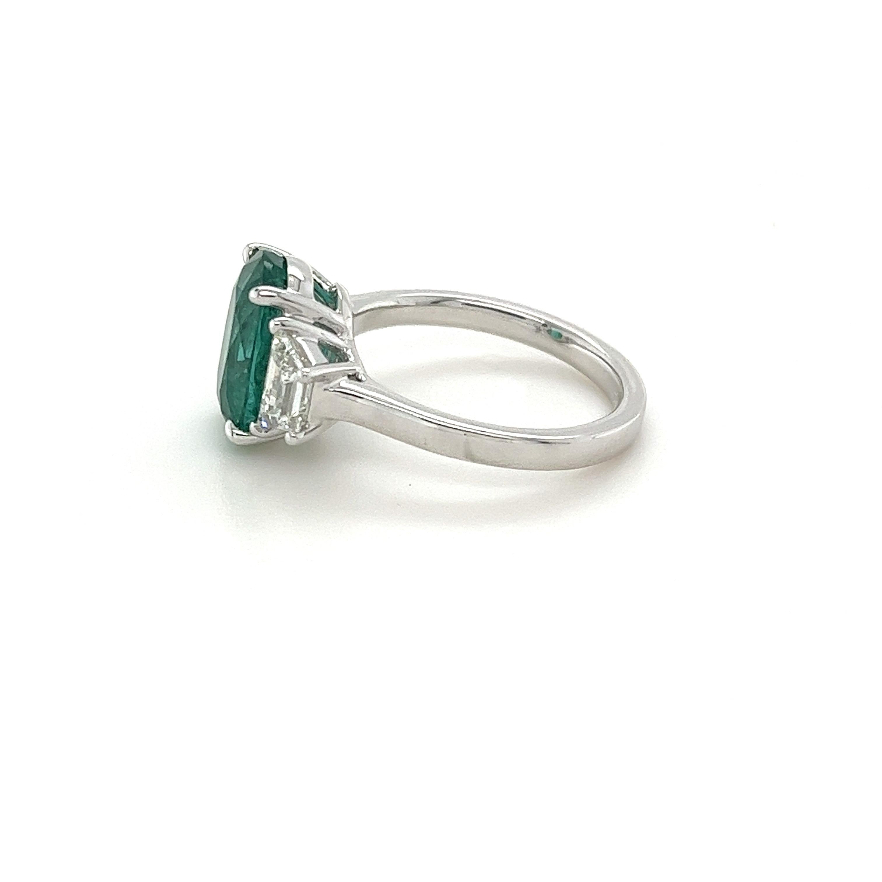 Modern Certified Oval Emerald & Diamond Three Stone Ring in Platinum For Sale