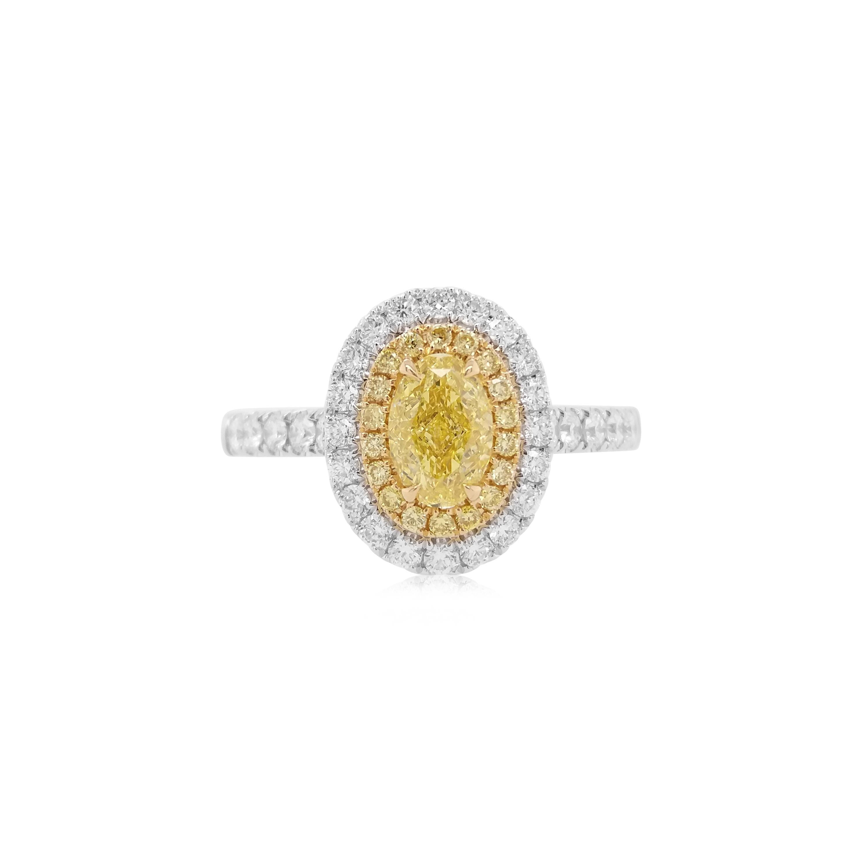 Made with Yellow diamond and white diamonds, set in gold and Platinum. The diamond's exceptional clarity and fire are complemented by a beautifully polished setting, offering both comfort and enduring style. 

Oval shape Fancy yellow diamond - 0.398