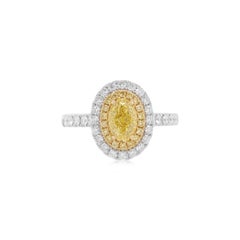 Certified Oval Shape Yellow Diamond Ring made in 18K Gold and platinum