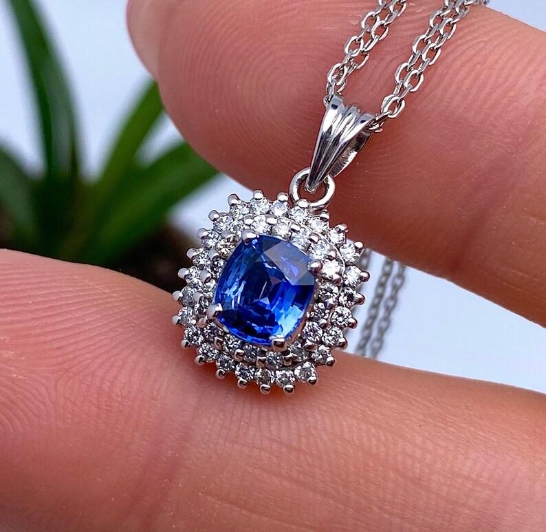 Natural Sapphire and Diamonds Pendant
14 Karat White gold

Pendant without chain.
Laboratory certified.
Main Stone: Sapphire
Main Stone Color: Blue
Main Stone Creation: Natural
Main Stone Treatment: Heated
Main Stone size: 1.07Ct/