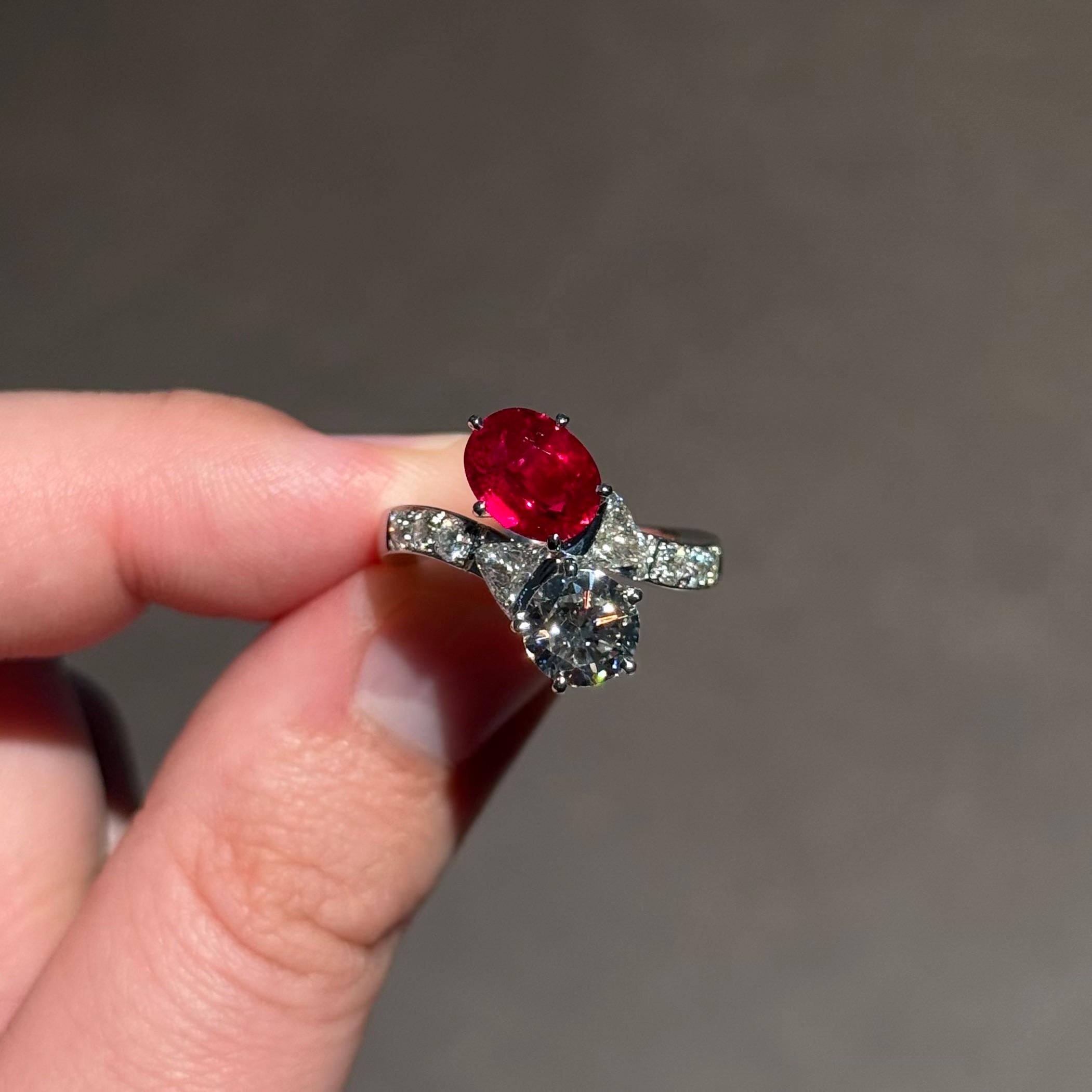 Certified Pigeon’s Blood Burmese ruby and diamond toi-et-moi engagement ring in 19.2kt white gold, Portugal circa 2000s. This extraordinary jewel features a rare and highly sought-after pigeon’s blood Burmese ruby, celebrated for its vivid, intense