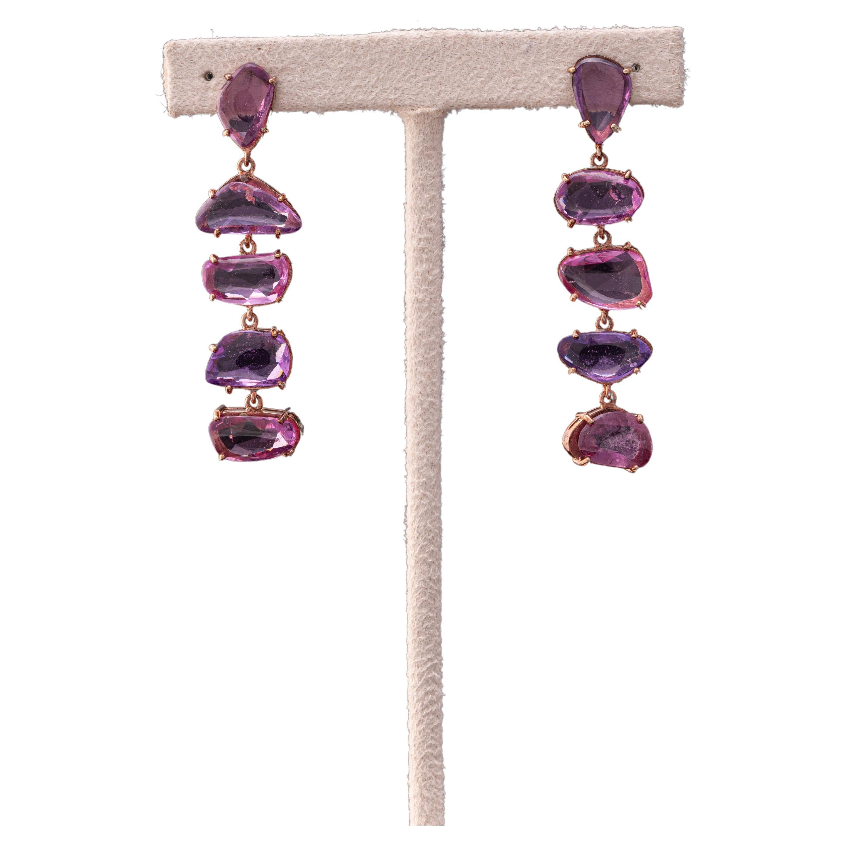 Darshna from Royaal Stones presents an exclusive pink sapphire earrings. This particular earring showcases dangling rose cut pink sapphires set in pink gold, and is created to fall elegantly on the wearer. 

Rose Pink Sapphires: 14.459 carats / 10