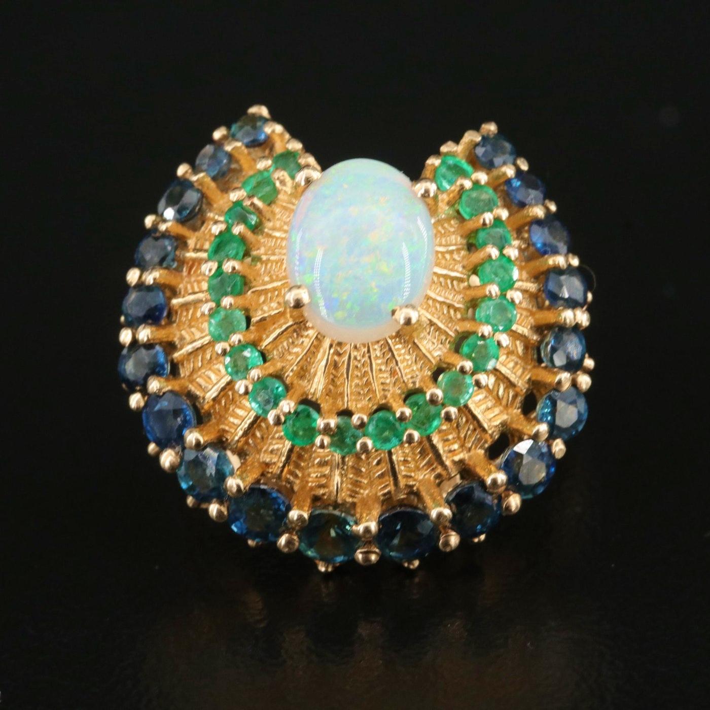 Princess Sumair Designer Ring - fully hallmarked (Franklin mint) Hallmarks: ©1988 FM 14K 585

The Gems of The Royal Peacock Ring, circa 1988 

NEW OLD STOCK

Opal, Emerald and Blue Sapphire, all natural and top quality

14K Yellow gold, stamped