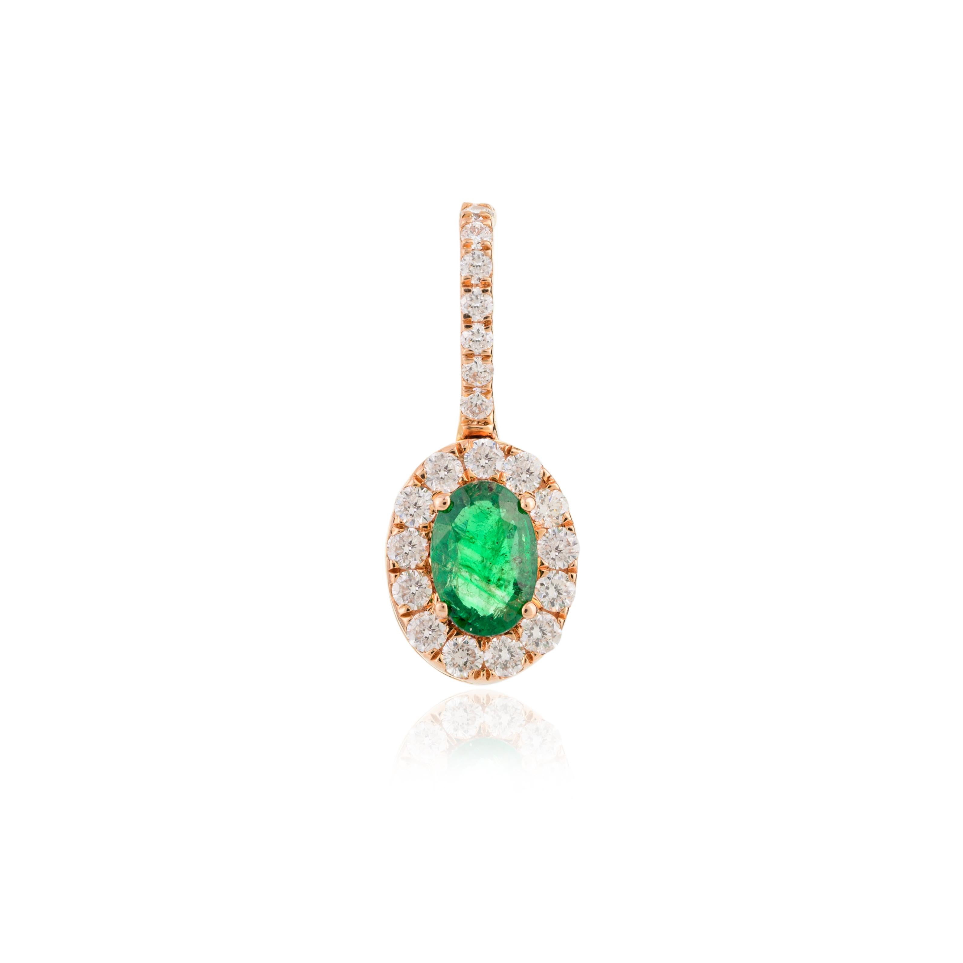 Dainty Certified Emerald Diamond Halo Pendant in 18K Gold studded with oval cut emerald and halo of diamonds. This stunning piece of jewelry instantly elevates a casual look or dressy outfit. 
Emerald enhances the intellectual capacity of the