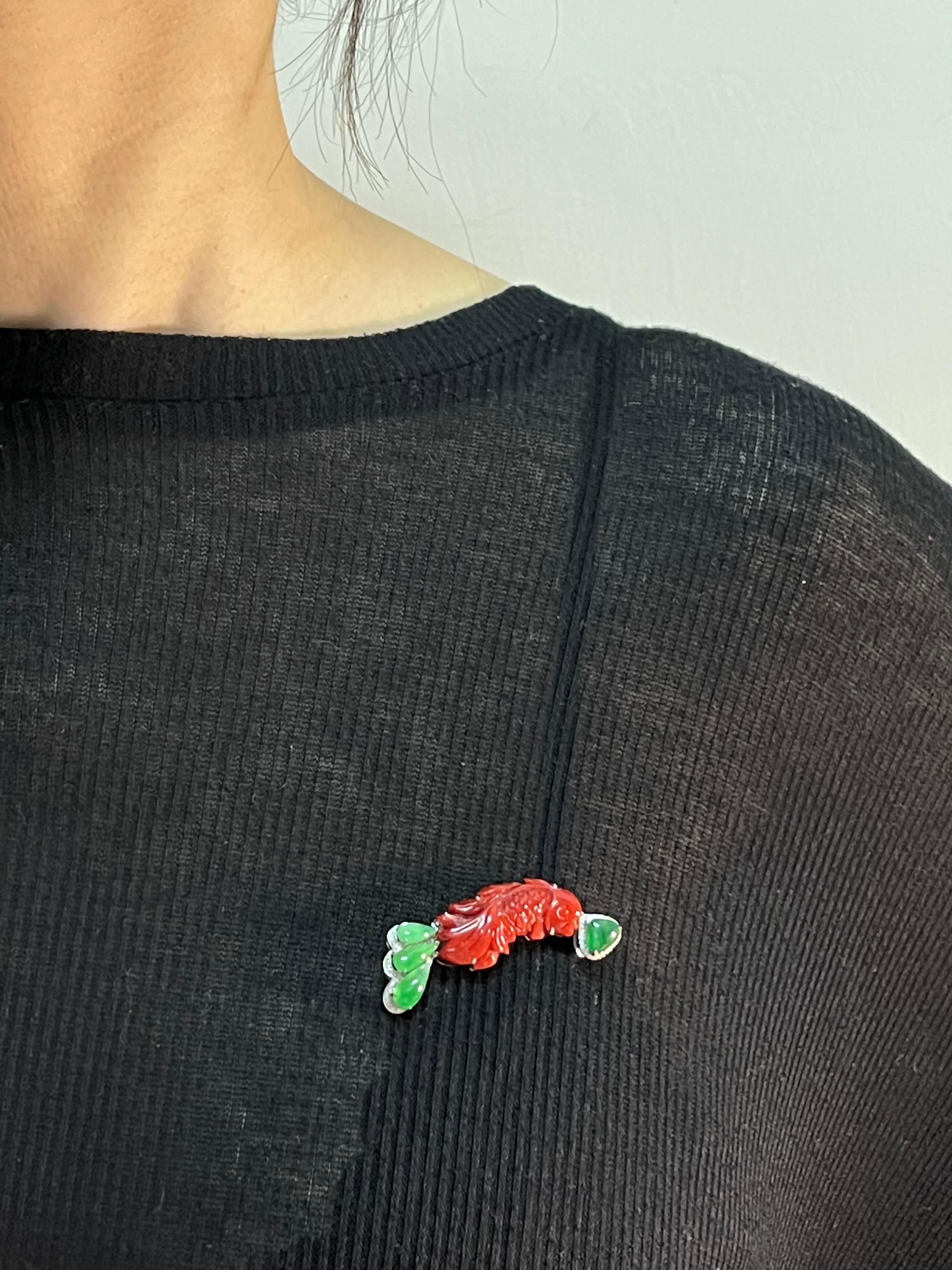 Please check out the HD video! This item can be used as a pendant or a brooch! This is a very well carved natural red coral Koi fish matched with glowing icy apple green jade and diamonds. There are 2 certificates, one for the natural red coral and