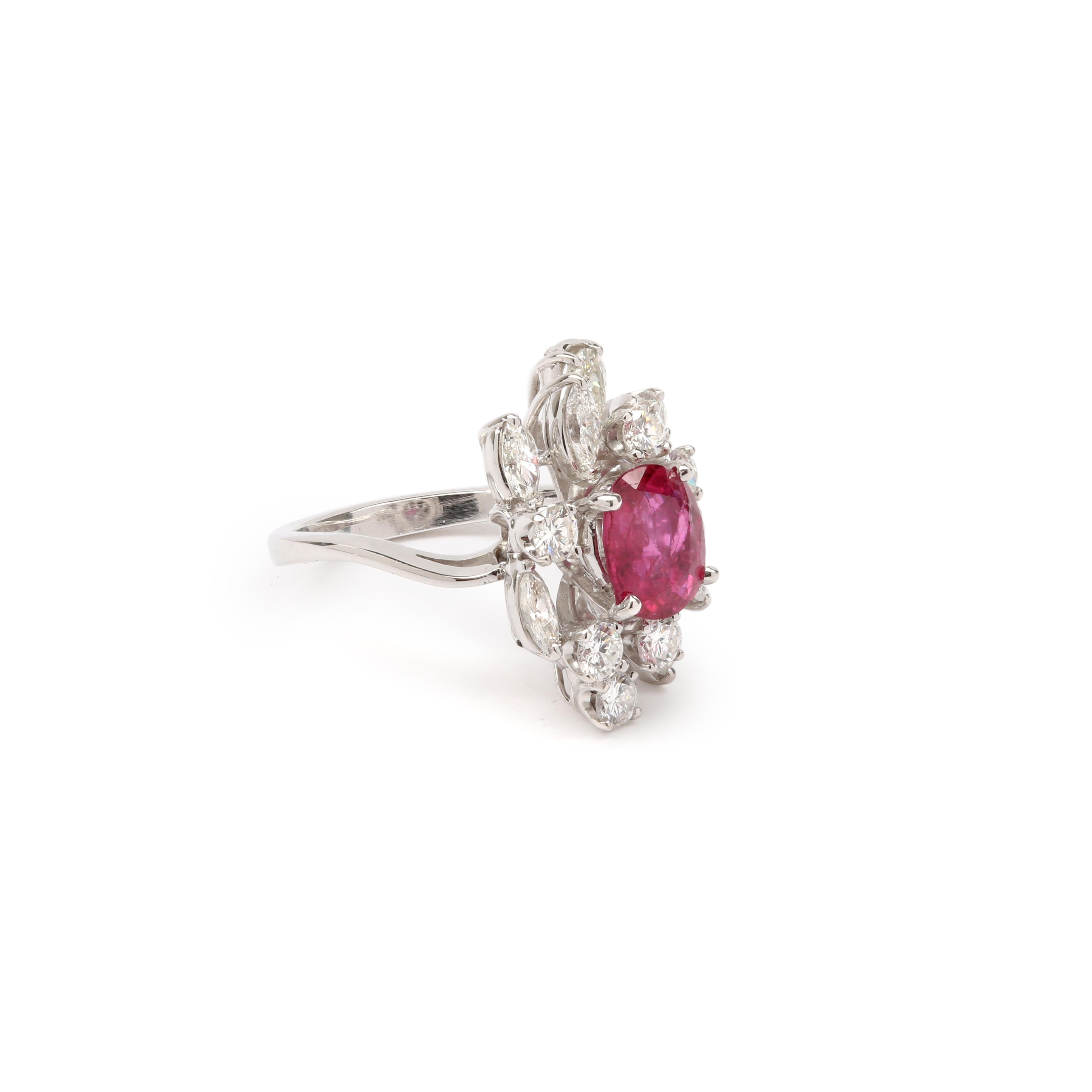 Magnificent ring set with a Thai ruby in a setting of brilliant and navette diamonds.

Estimated weight of the ruby : 1.75 carats

With Carat Gem Lab certificate, specifying natural ruby, intense red, origin Thailand.

Natural stones may have some