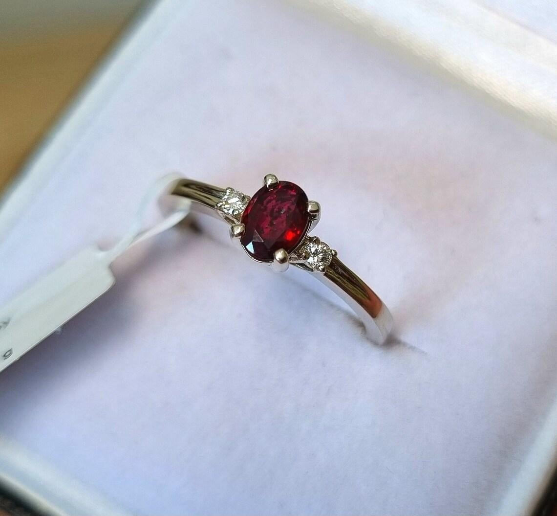 Natural Ruby and Diamond gems
14 Karat White Gold Ring

Laboratory full certificate
Main Stone: Ruby
Main Stone Creation: Natural
Main Stone Color: Red
Main Stone Origin: Mozambique
Main stone size: 5,8x4,2mm 0.6Ct
Ring Size: 7.25US (17,5mm)
Ring