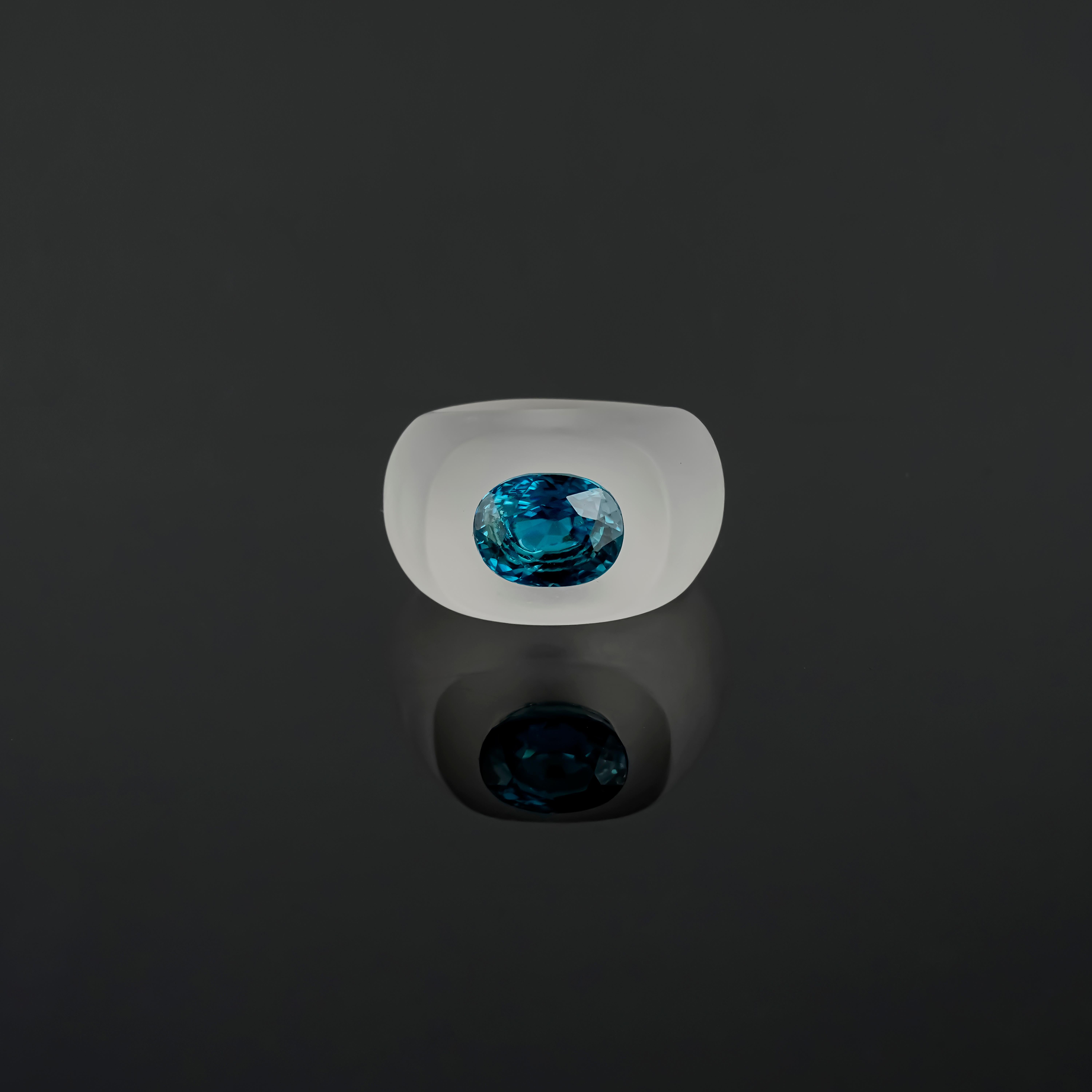 Make a statement with this stunning 10.62 carat Blue Zircon oval shaped studded in Rock Crystal. The ring is currently sized at size US7. The ring can be customized, and resized. 
Please feel free to message us for more information. 
We provide free