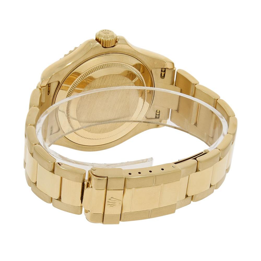 Rolex Yacht-Master Reference #:16628. Rolex Yacht-Master Watch. 40mm 18K yellow gold case, Graduated Yellow Gold bezel, White Mother-of-pearl dial, ruby hour markers, date indicator, sapphire crystal, automatic movement, Oyster flip-lock bracelet.