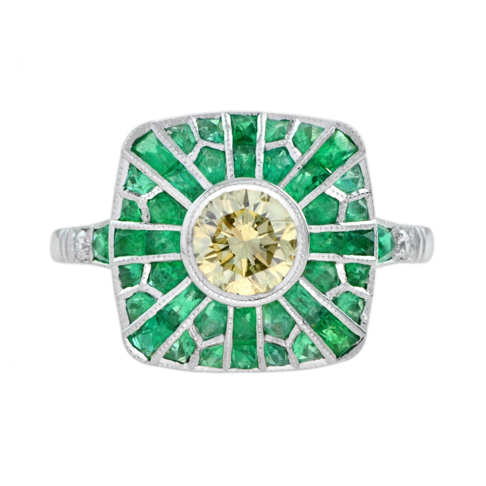 In this superb and stunning bright and shining round cut fancy yellow color, SI2 clarity diamond, weighing 0.63 carats, beam brilliantly from within a striking cushion setting accentuated all around with green French cut emeralds, total weight 3.70
