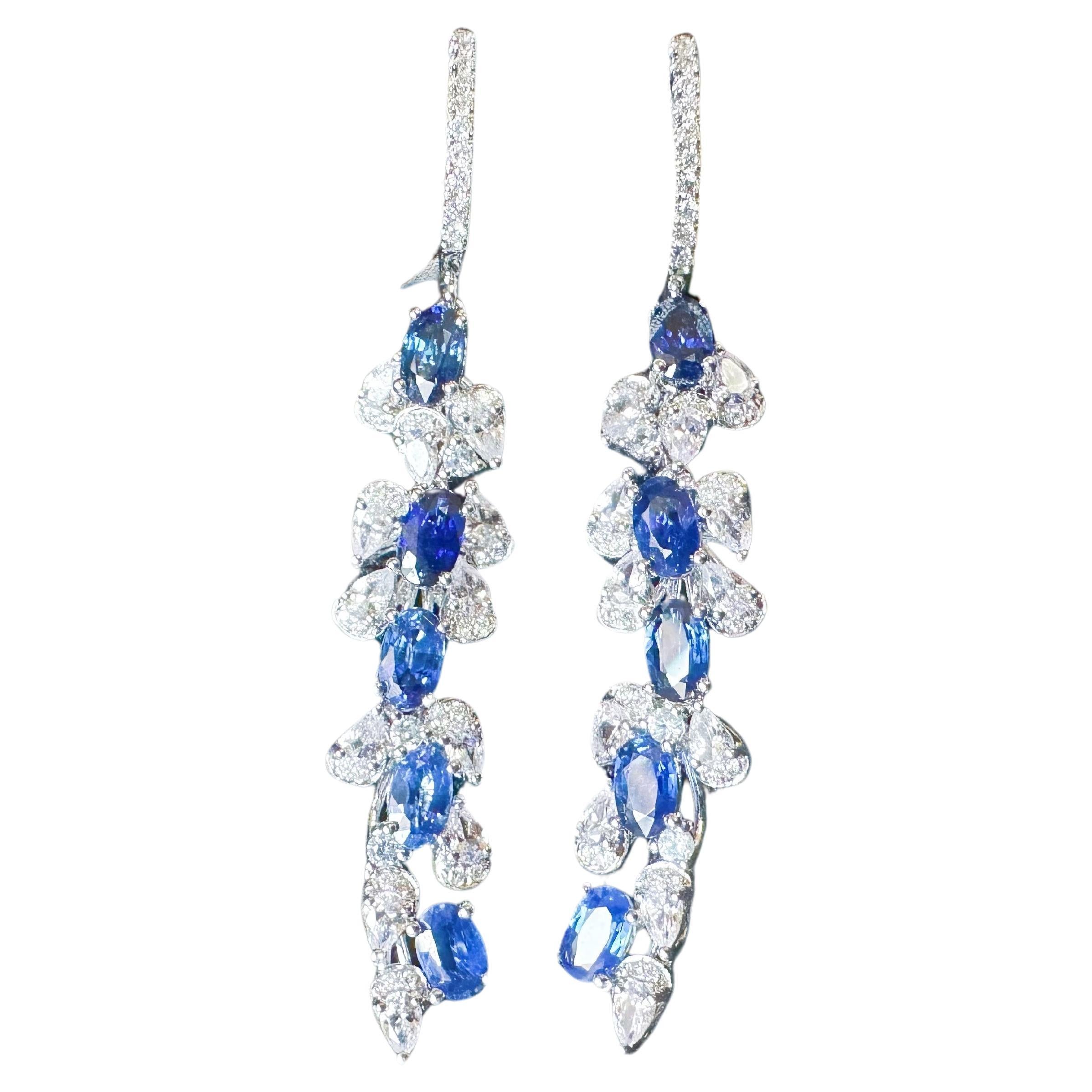Elevate your style with our timeless and elegant dangle earrings. These exquisite earrings feature royal blue sapphires, diamonds, and white sapphires, carefully handcrafted to perfection.

With their meticulous craftsmanship, these earrings make a
