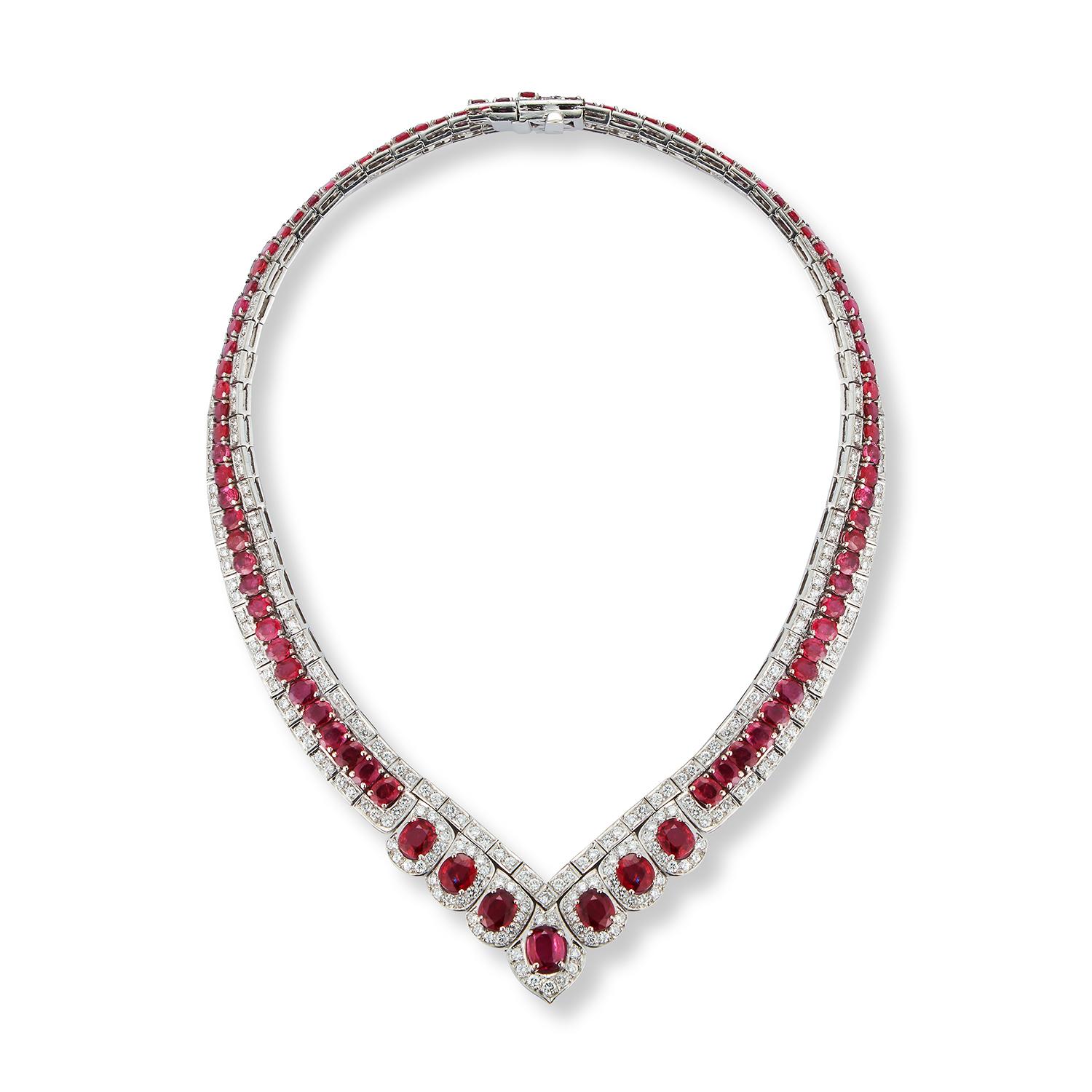 Certified Ruby & Diamond Shaped Necklace
7 larger oval rubies & 86 smaller oval rubies approximately 48.50 Cts 
330 round cut diamonds Weight: approximately 12.50
Measurements: 14