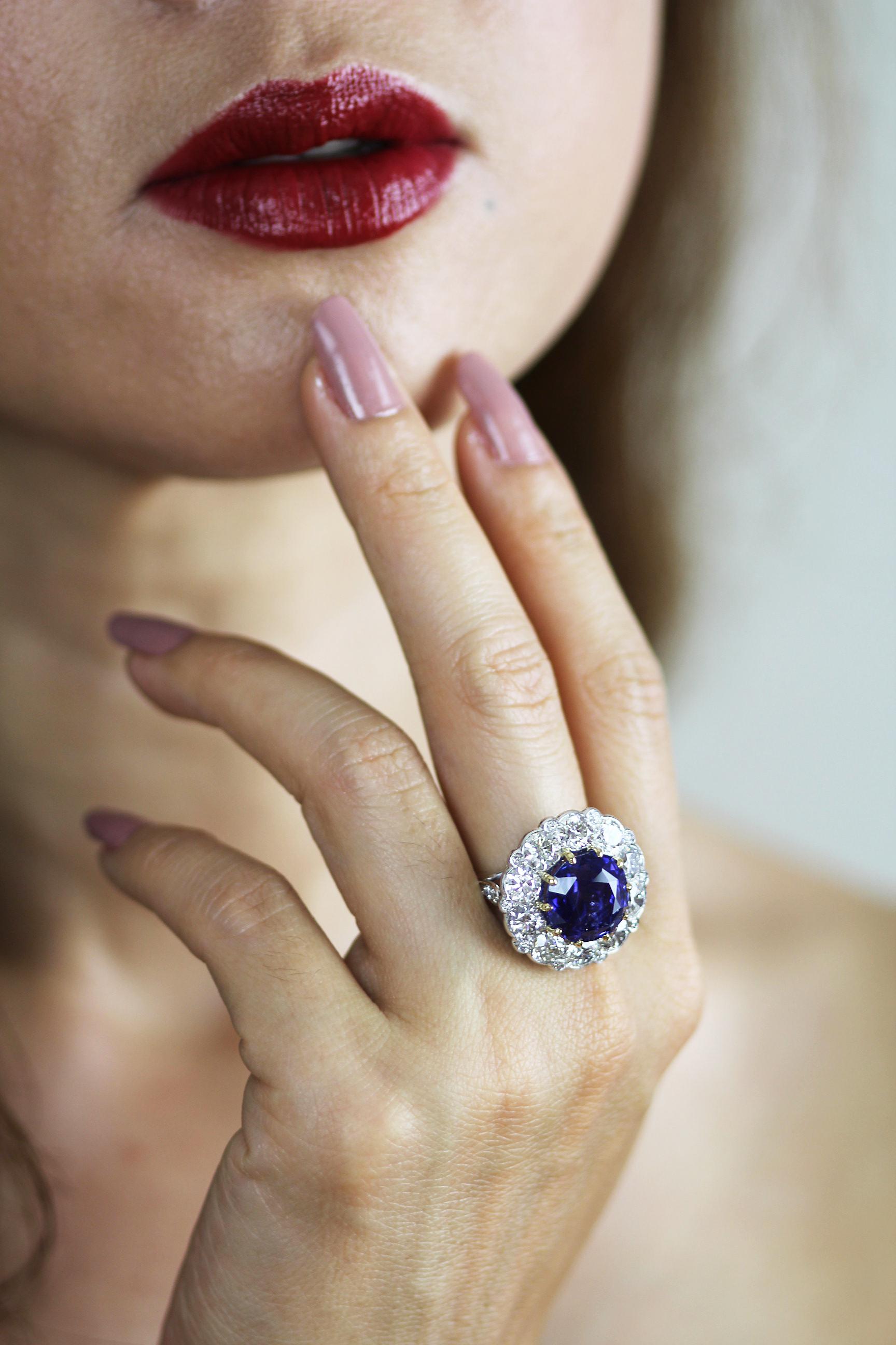 Sapphire and diamond ring set in platinum. Centering a bold powerful royal blue sapphire, which is then surrounded by round brilliant diamonds on a raised platform to resemble a flower.
1 x Sapphire, square cushion shape with The Gem & Pearl