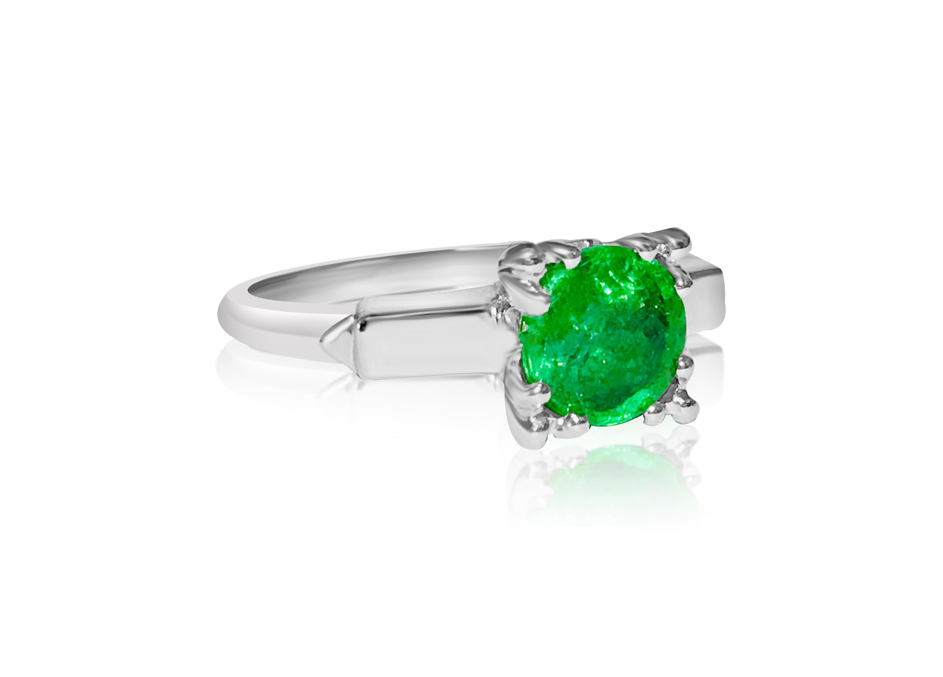 Metal: Platinum 

2.00 carat emerald. Round cut set in prongs. 100% natural earth mined emerald. 

Ring size: US 6.25. Free ring resizing available 

Beautiful emerald and platinum ring. Vintage style engagement ring. 

Certified by GIA graduate