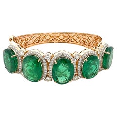 Atemberaubendes Armband aus 18 Karat Gelbgold mit Smaragd und Diamanten