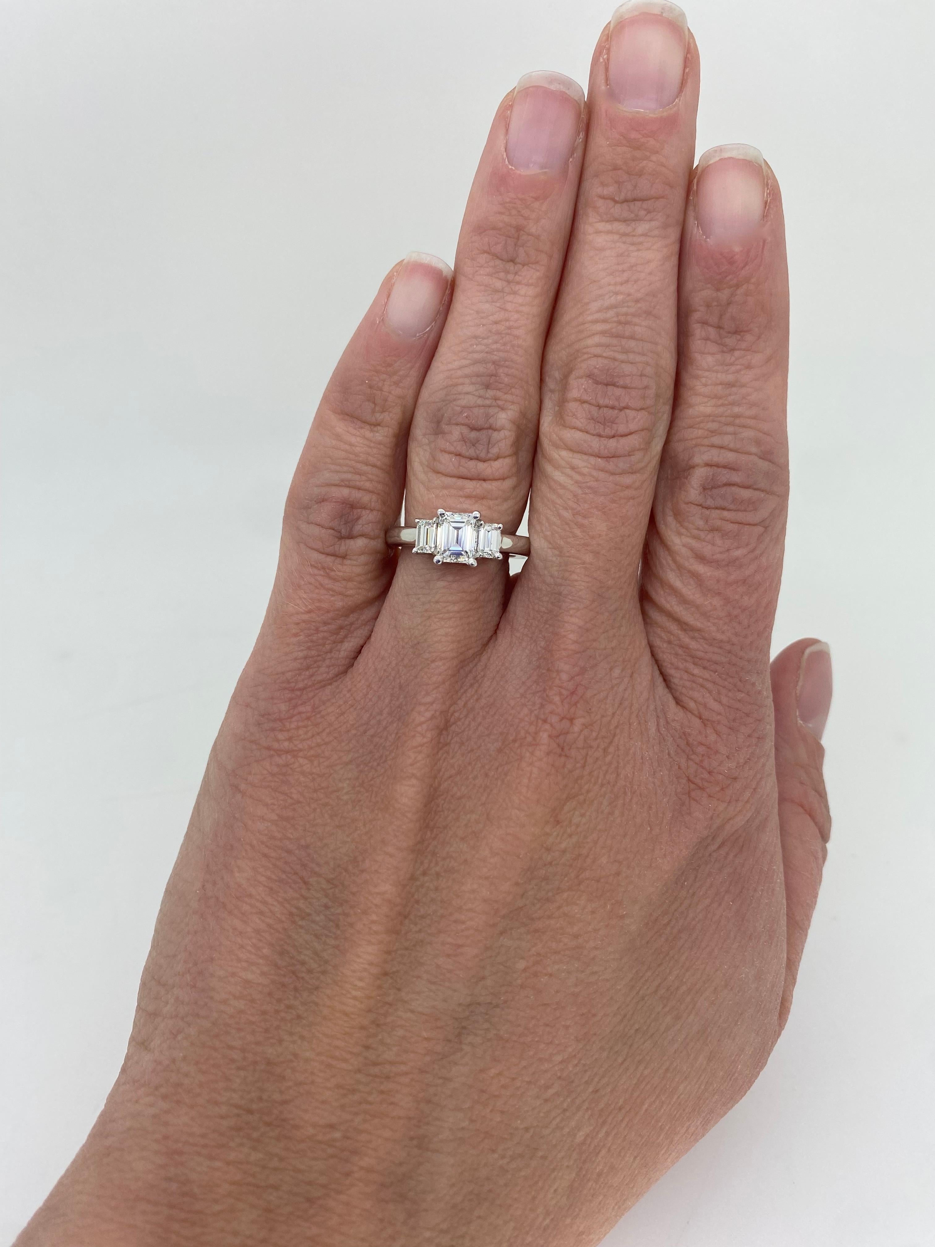 Stunning three stone Emerald cut diamond engagement ring made in 14k white gold, and certified by IGI. 

IGI Certification # 30020164G
Center Diamond Carat Weight: 1.00CT
Center Diamond Cut: Emerald Cut
Center Diamond Color: H
Center Diamond