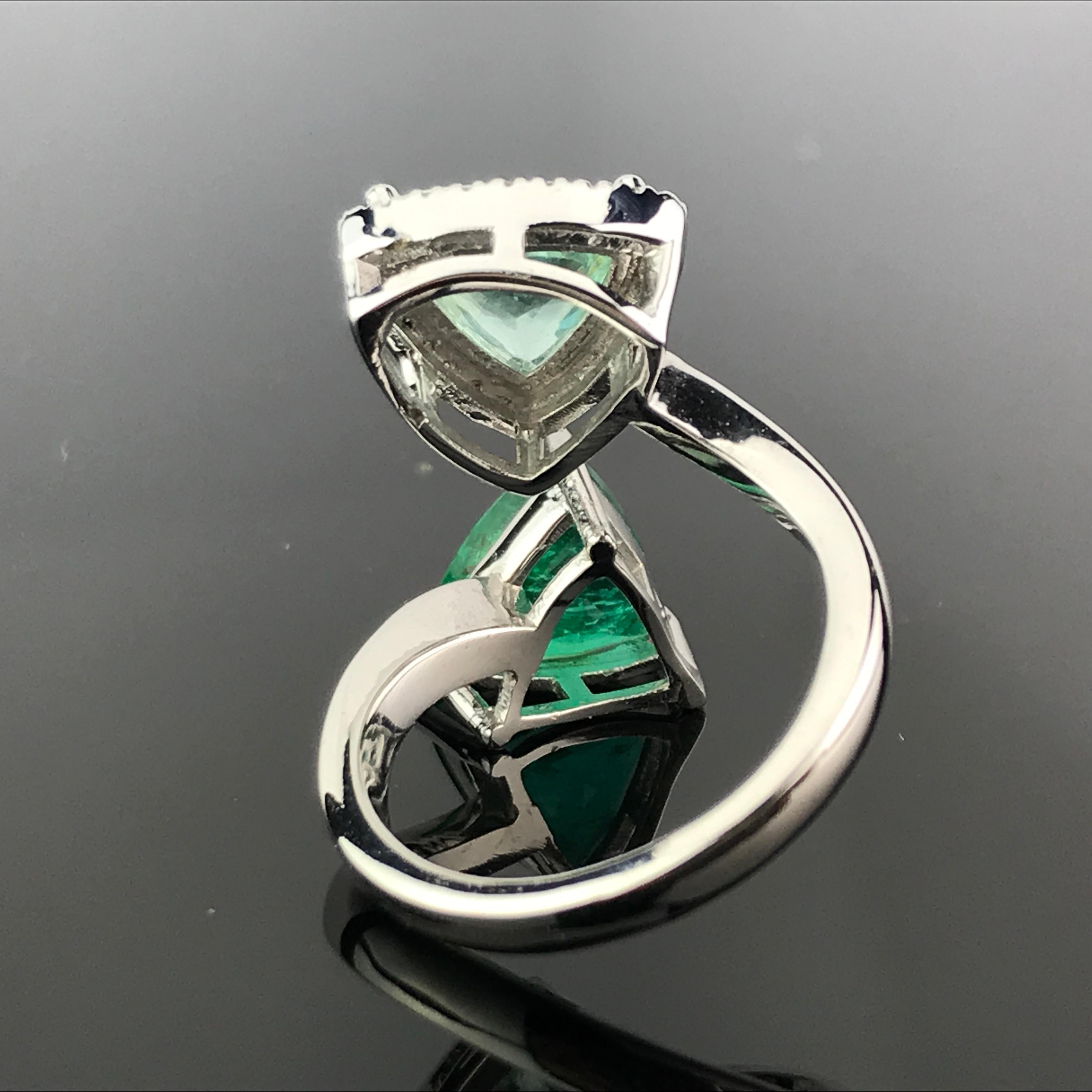 A statment ring, focusing on the trillion shaped Zambian Emerald and Pariaba Tourmaline, which complement each other beautifully.  Ring is currently sized at US 6, complimentary resizing/repolish service is provided. 

Stone Details:  
Stone: