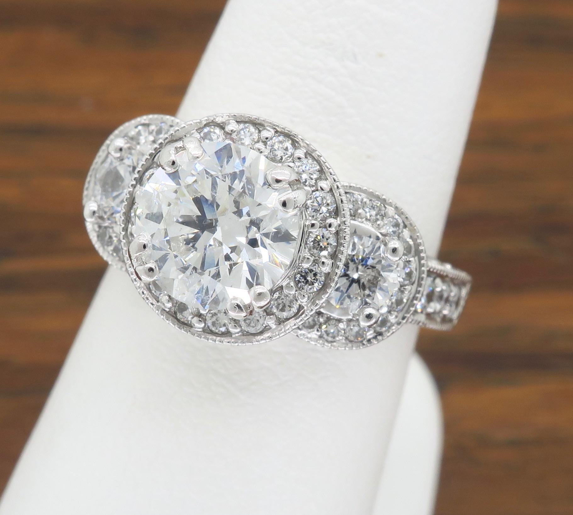 Round Cut Certified Triple Halo Diamond Engagement Ring in 18 Karat White Gold