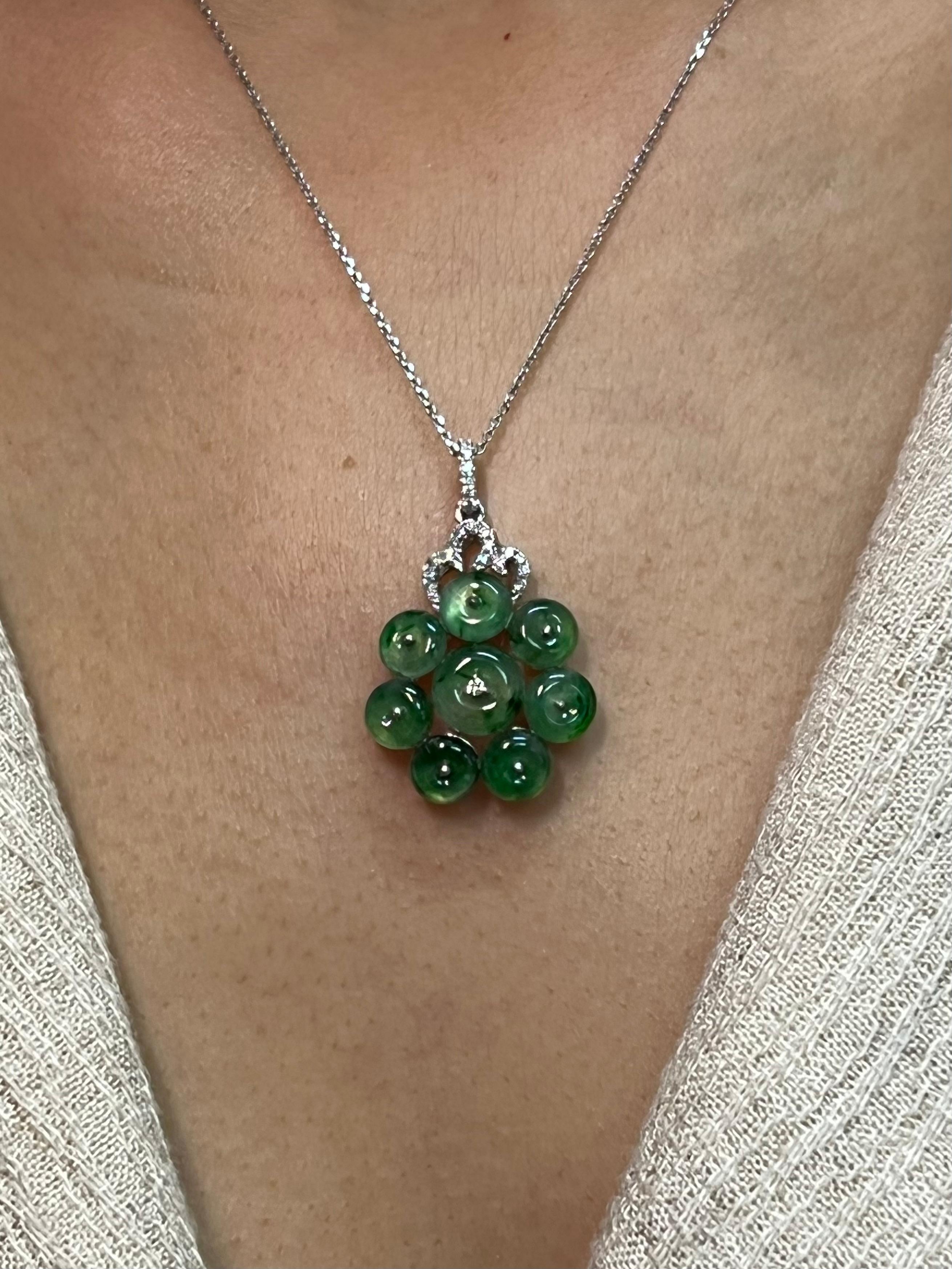 Please check out the HD video! Here is a nice cluster Jade flower pendant. The diameter of the jade part is about 19mm each. The total length the pendant is about 3.1cm. The pendant is set in 18k white gold and diamonds. There are 23 white diamonds