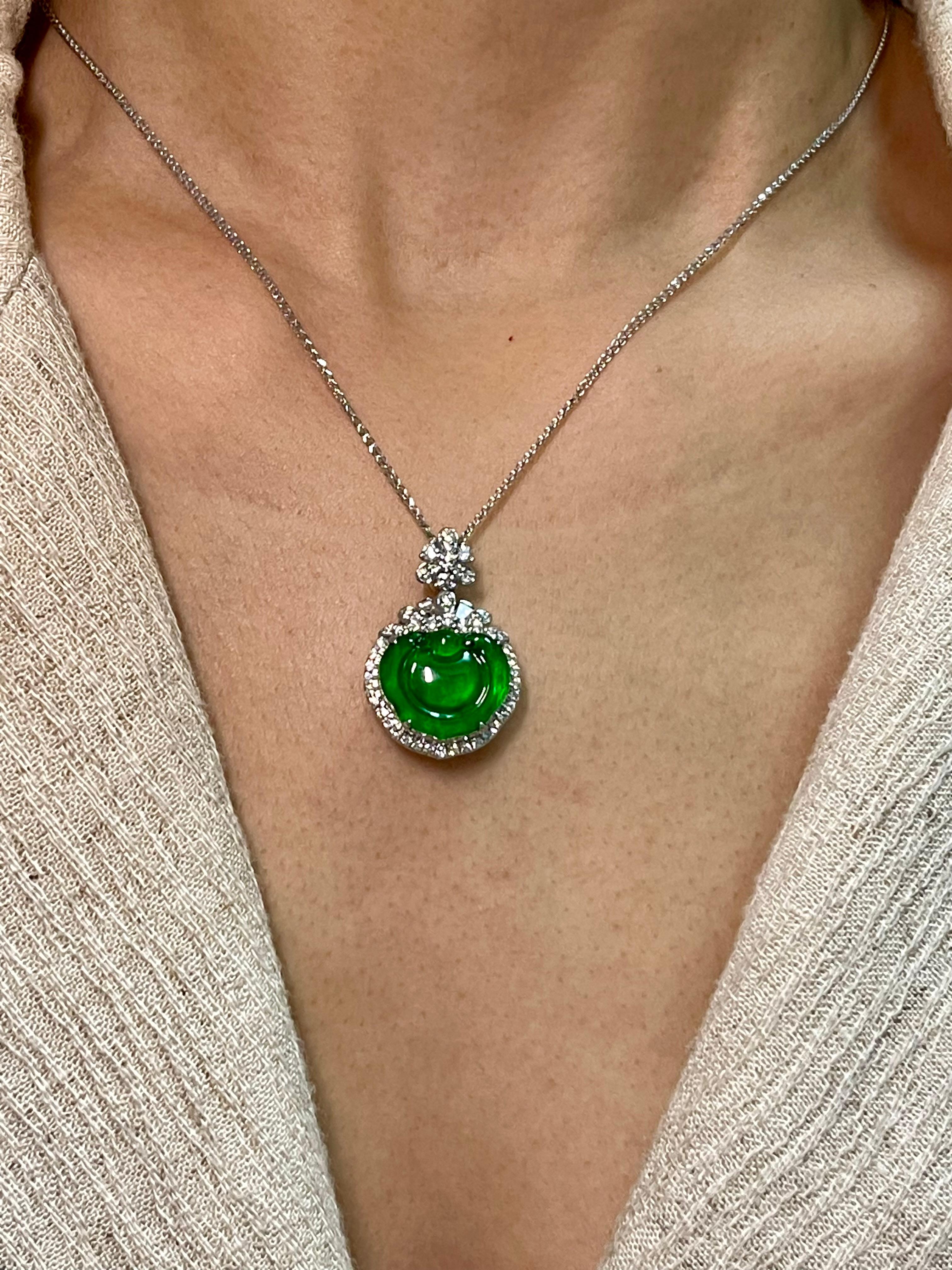 Please check out the HD video. This jade has a beautiful balance of color saturation and transparency! Here is a natural apple green Jade and diamond pendant. It is certified by 2 labs. The pendant is set in 18k white gold and diamonds. There are