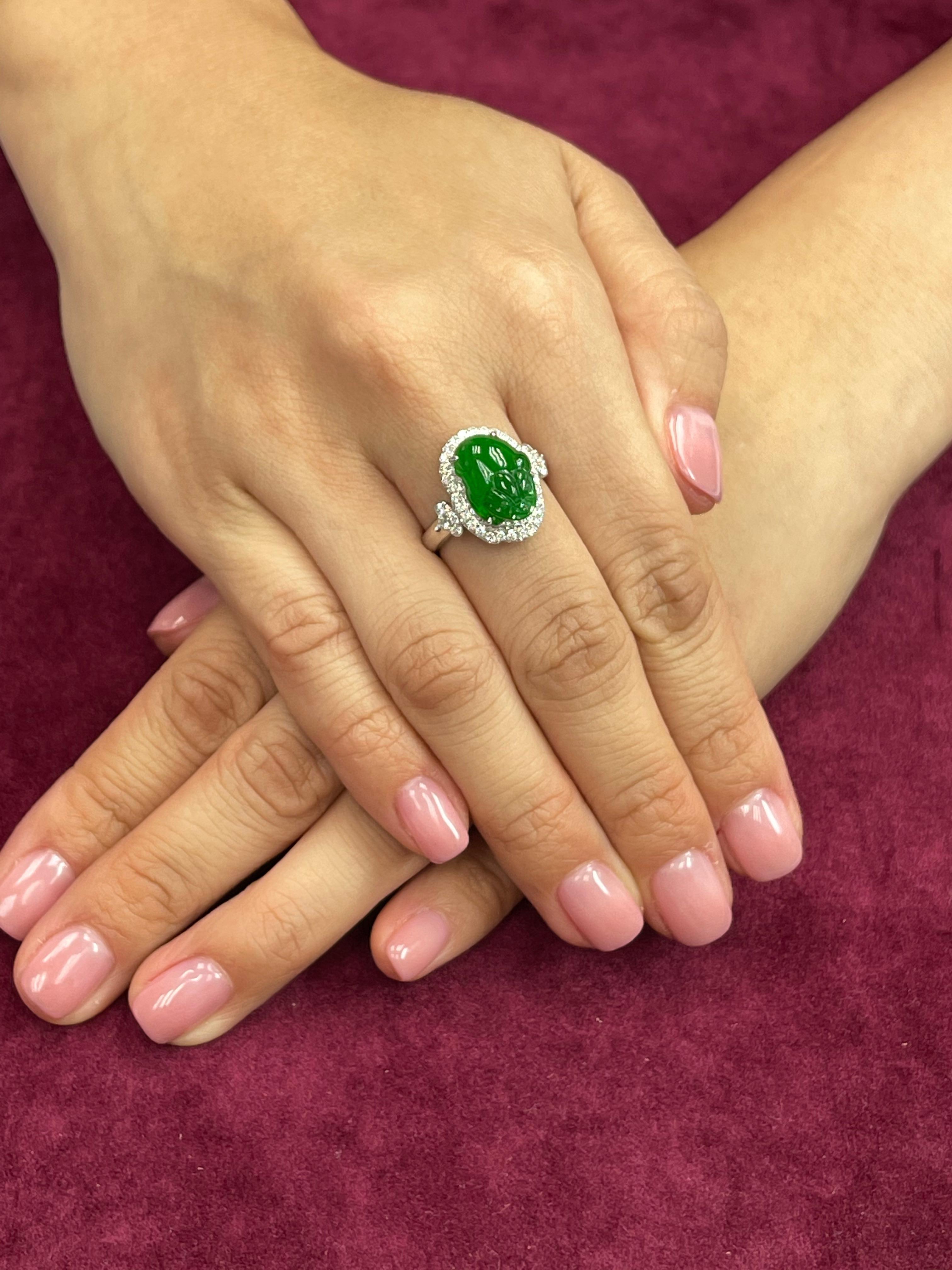This ring has the best imperial green color, it GLOWS! Here is an imperial green Jade and diamond ring. It is certified by 2 labs natural jadeite jade. The ring is set in 18k white gold and diamonds. There are white diamonds totaling 0.457 cts. The