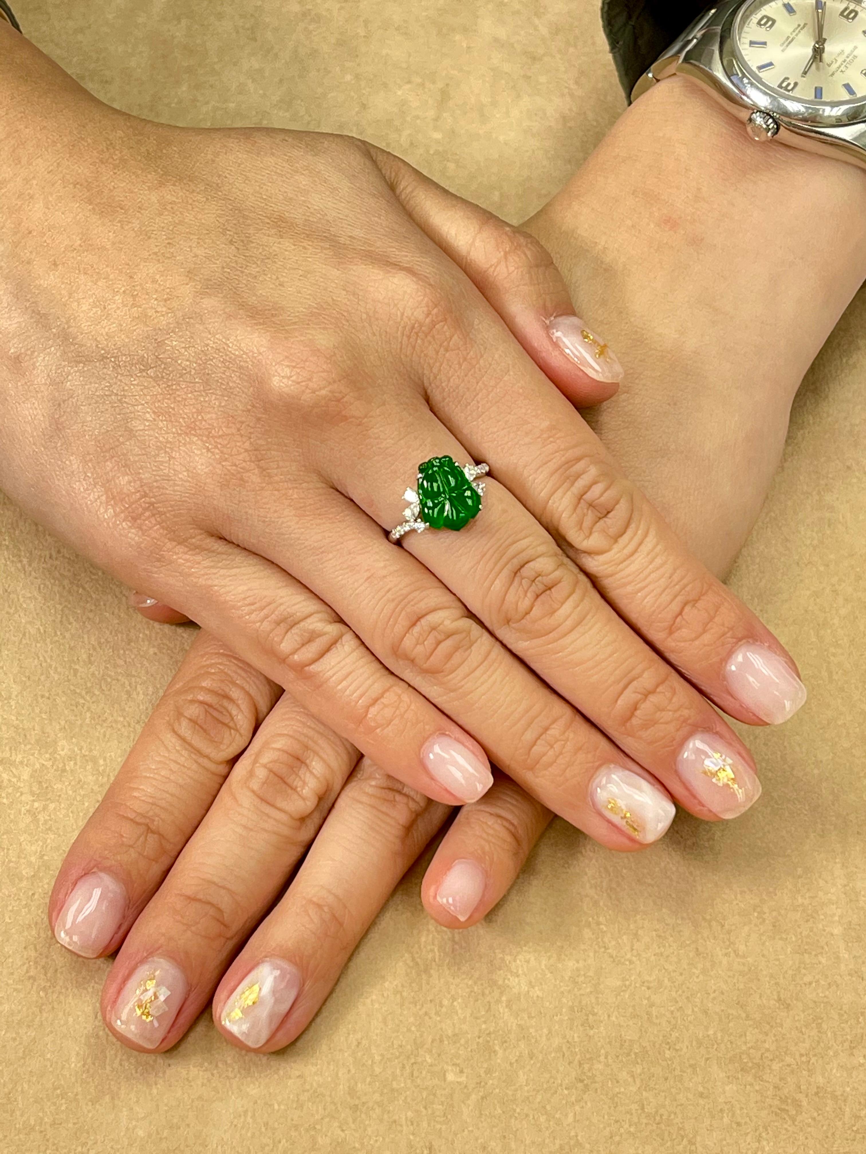 This ring has the best imperial green color, it GLOWS! Here is an imperial green Jade and diamond ring. It is certified by 2 labs natural jadeite jade. The ring is set in 18k white gold and diamonds. There are white diamonds totaling 0.275cts. The