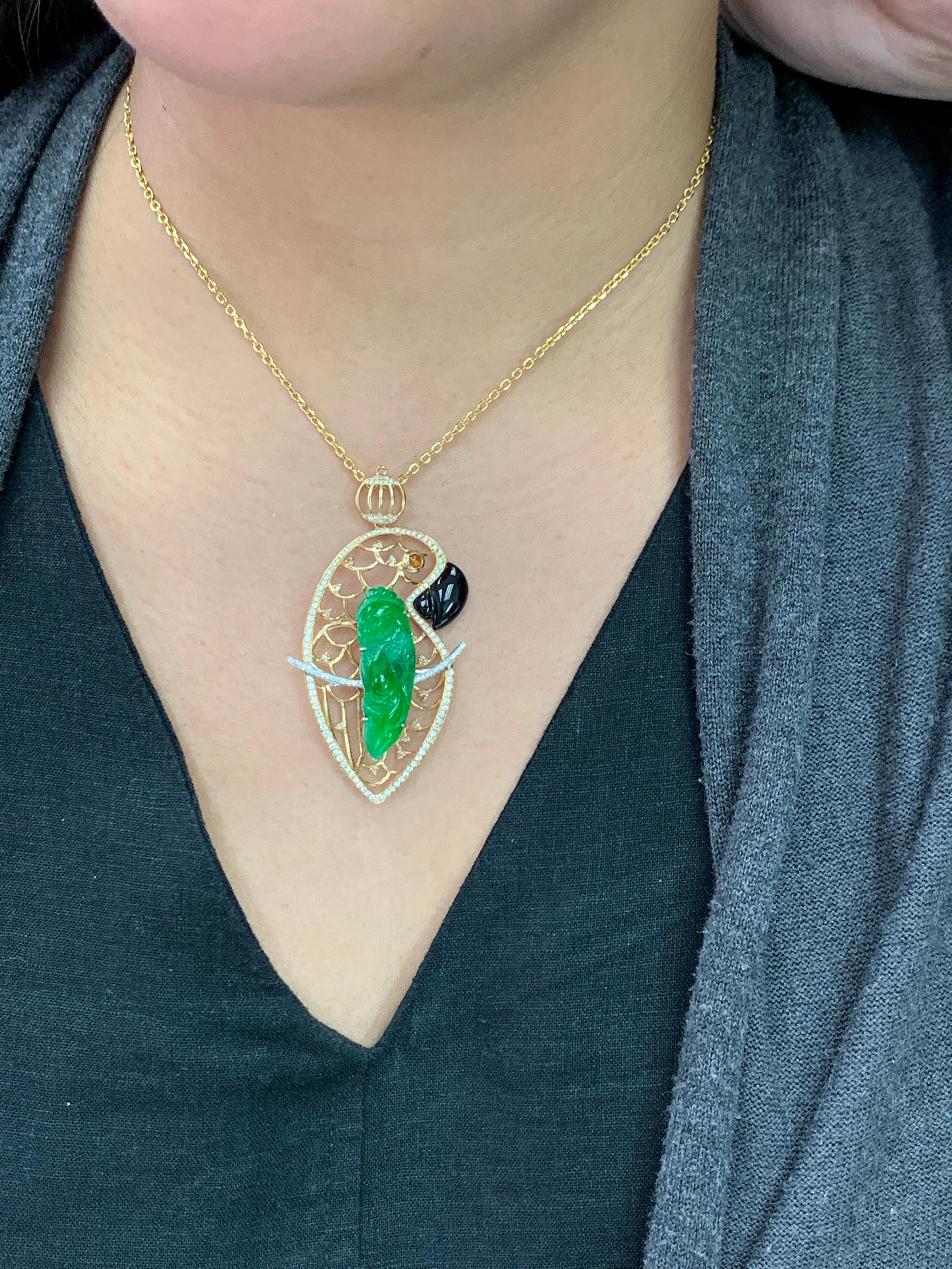 The design of this Parrot within a Parrot is quite clever! Here is a vivid green Jade and diamond parrot pendant. It is certified. The carved parrot is vivid green and close to the best color in Jade. Best color being imperial green. (just one shade