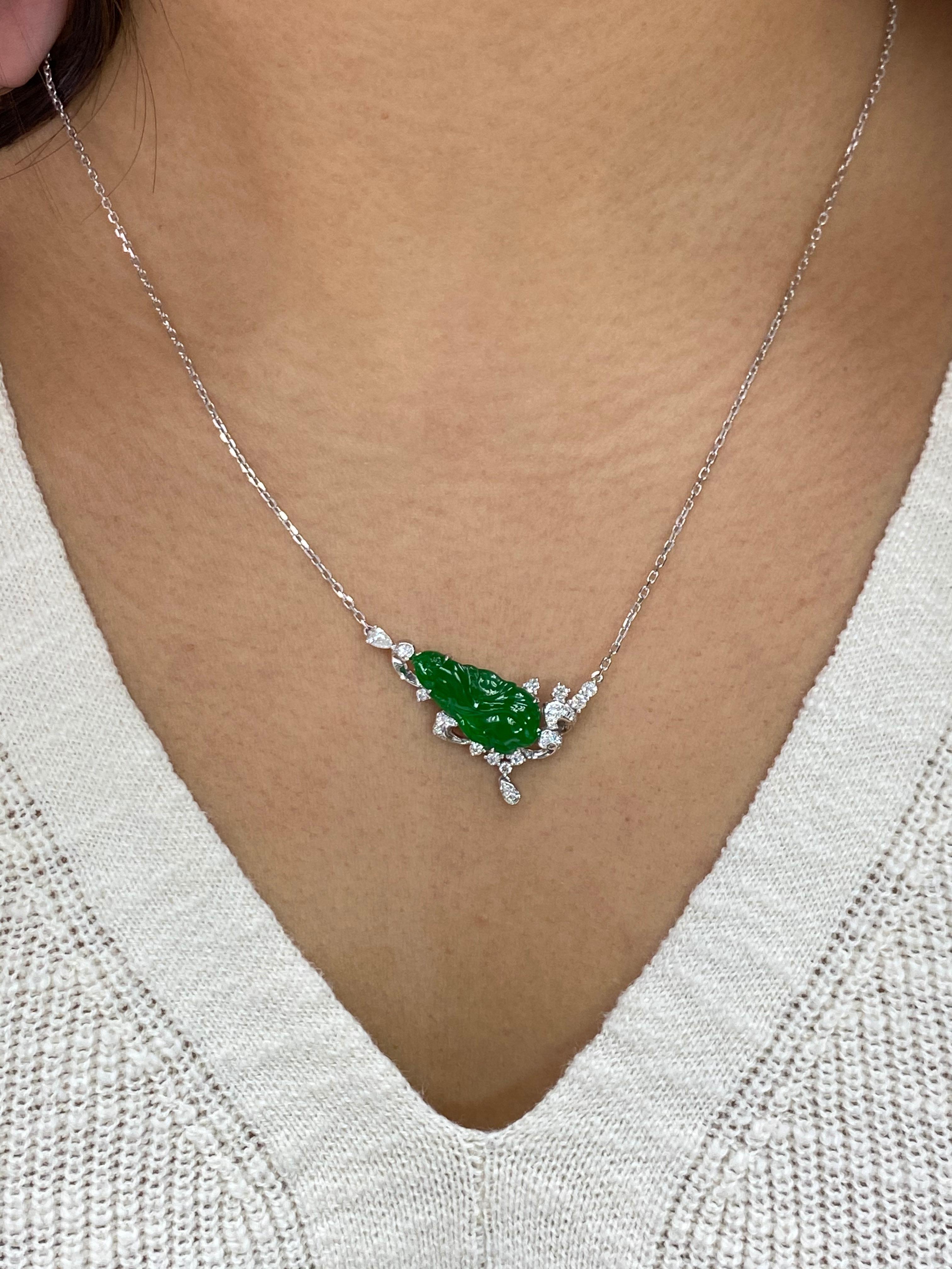 Here is a natural Jadeite Jade and diamond pendant with excellent best imperial green color. It is certified by 2 different labs. The pendant is set in 18k white gold and diamonds. There are diamonds totaling about 0.25 cts set into the pendant. The