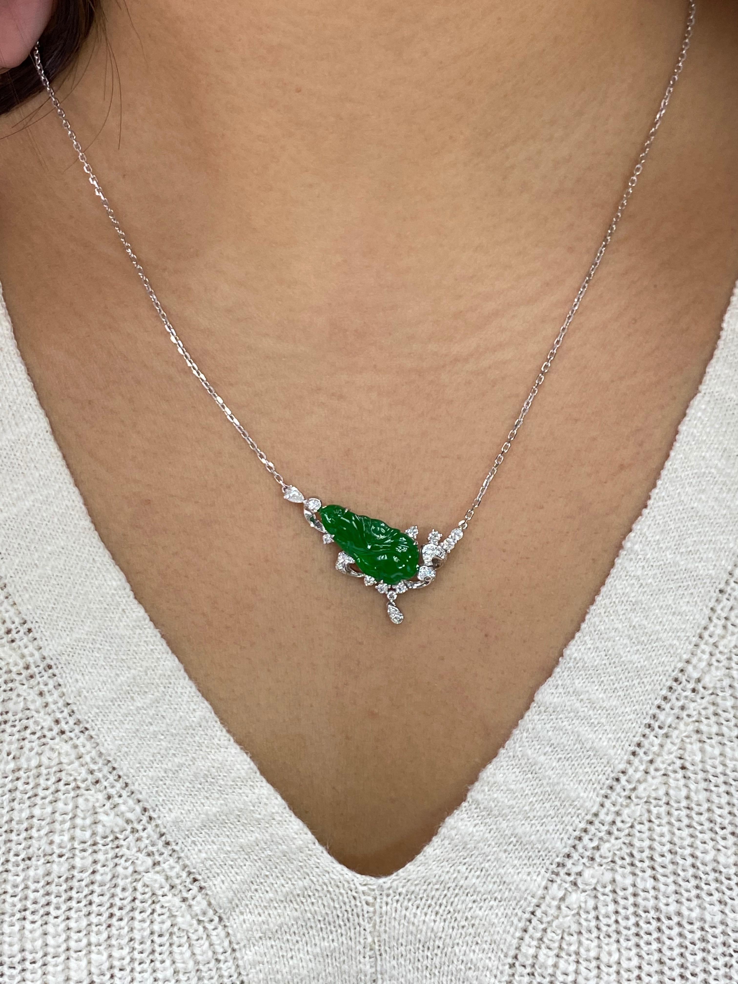 Here is a natural Jadeite Jade and diamond pendant with excellent best imperial green color. It is certified by 2 different labs. The pendant is set in 18k white gold and natural diamonds. The untreated / un-enhanced natural jade is full of life.