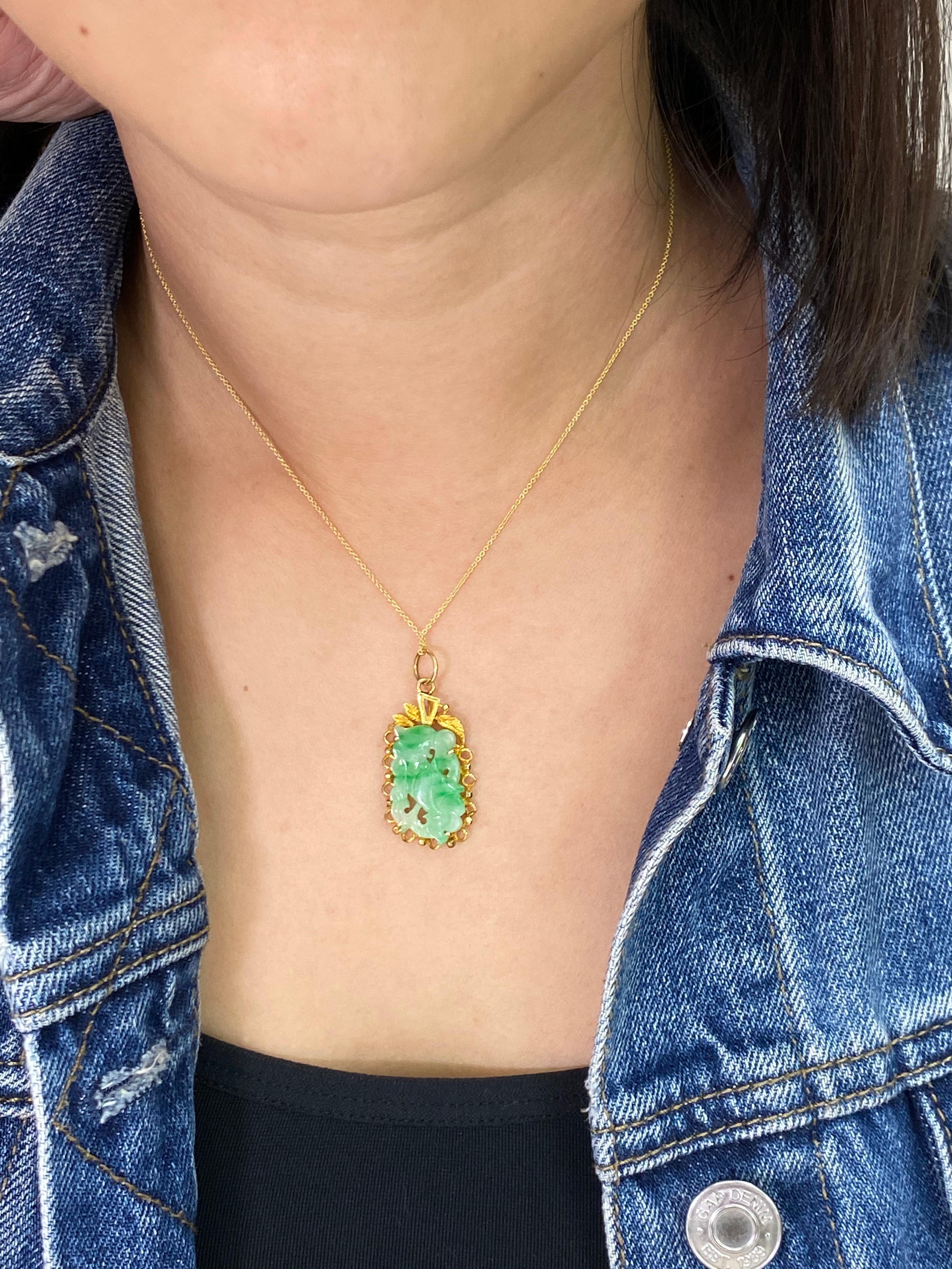 NEW OLD STOCK (from my grandfather's stock) ! Here is a natural Jadeite Jade pendant with excellent apple green veins running through the whole piece. It is certified natural jade with no treatment. The pendant is set in high karat yellow gold