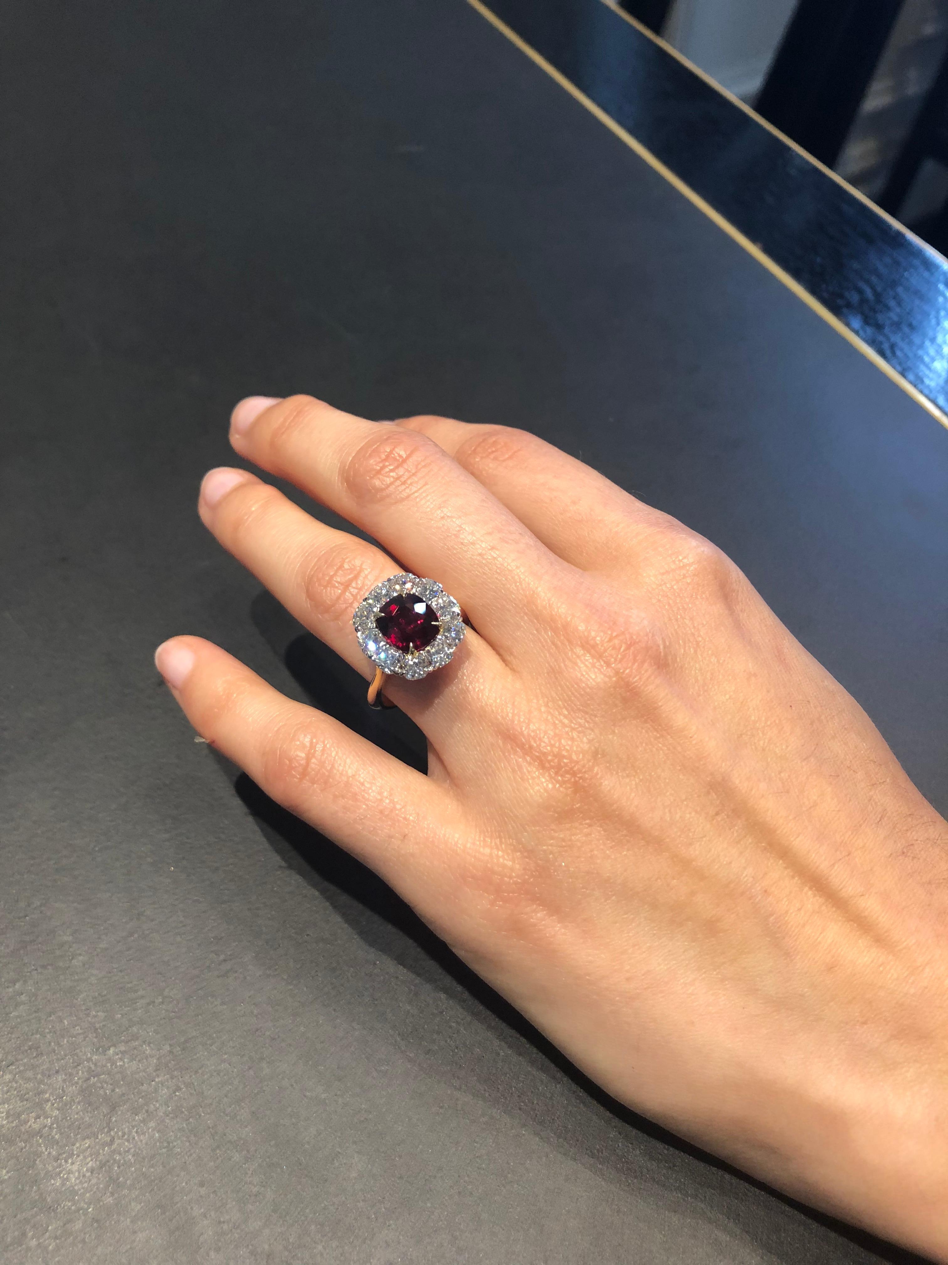 Stunning Hand made, 18 Carat Yellow and White gold Dress Ring, Set with a Certified, Natural, Un-heated 'Deep Red' Mozambique, 3.01 carat Round Ruby as per GSL AA61947/2U, set in Yellow gold claws, surrounded by 10 Cushion cut white diamonds, 10
