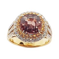 Bague en or rose 18 carats avec diamants et saphir rose orangé non chauffé de 3 carats certifié