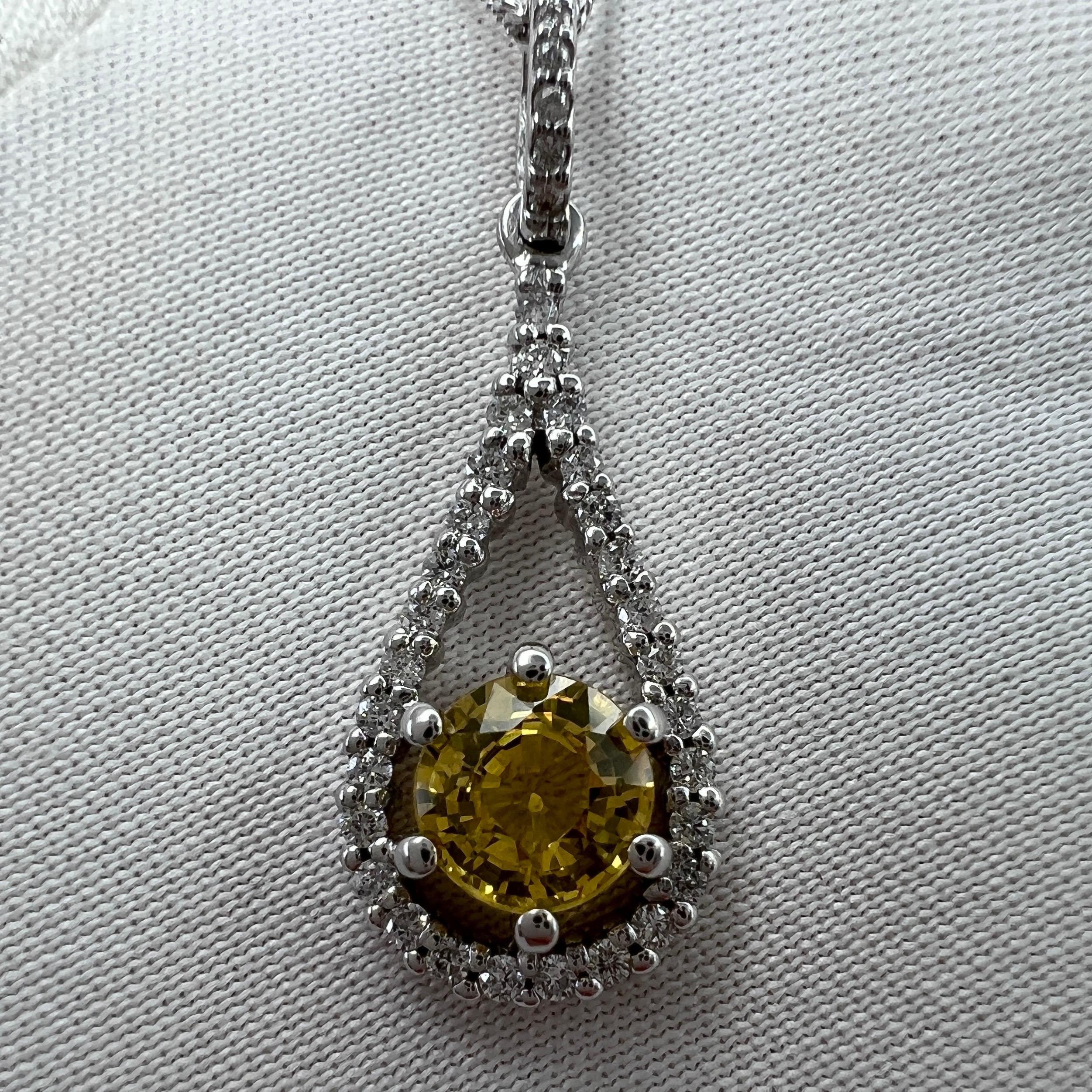 Natural Untreated Vivid Yellow Certified Sapphire & Diamond 18 Karat White Gold Pendant Necklace.

Stunning natural yellow sapphire set in a fine 18k white gold diamond set pendant.

5mm centre sapphire (0.69ct) with a stunning vivid yellow colour