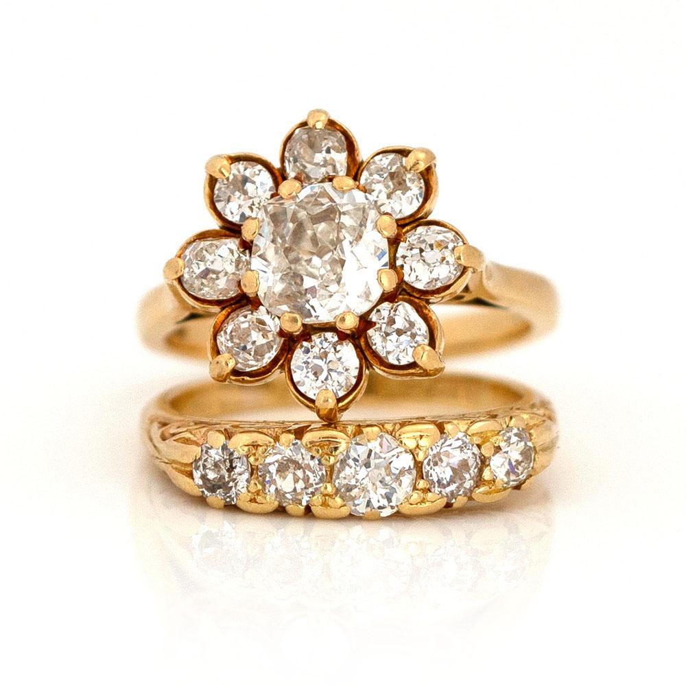 Our exquisite vintage diamond ring showcases a captivating 1.25ct Old Mine cut diamond at its center. This near-colorless diamond, graded 'I' for color and 'VS2' for clarity, is encircled by a halo of diamonds in both Old Mine and Old European cuts.