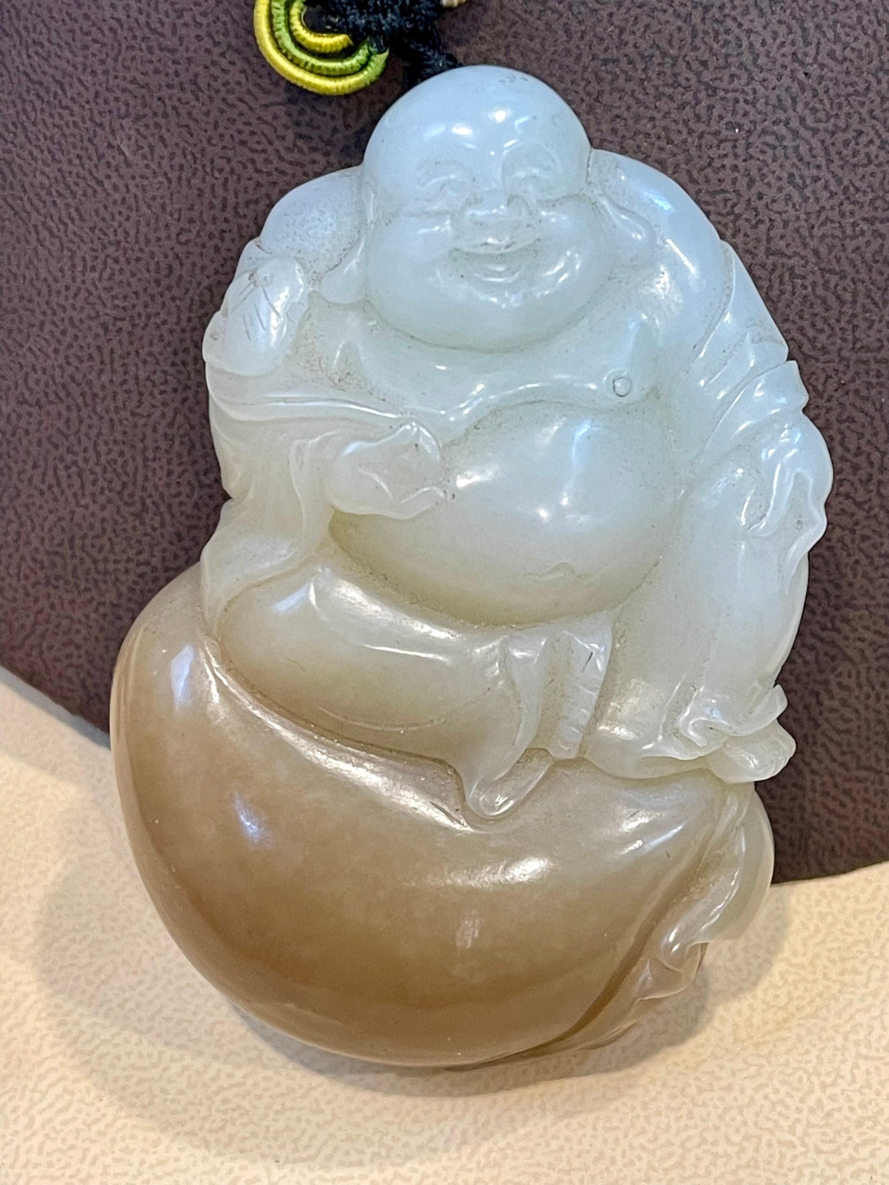 Certified Vintage 1950s Carved Jade Laughing Buddha Large Pendant Jade Necklace/ Hanging / Decor
It is supposed to be very lucky for the household people
It is certified and certificate is attached 
VINTAGE
PRE-OWNED 
ESTATE PIECE from 1950.s