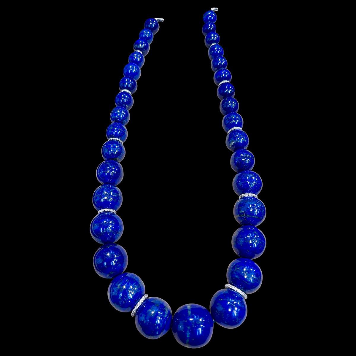 
Certified Lapis Lazuli Vintage Lapis Lazuli Single Strand Necklace  with 2.5 Carat Diamond ringlets and  14 Karat  White Gold Clasp
This marvelous vintage Lapis Lazuli  necklace features 1 row of luscious  huge Beads with 10 diamond