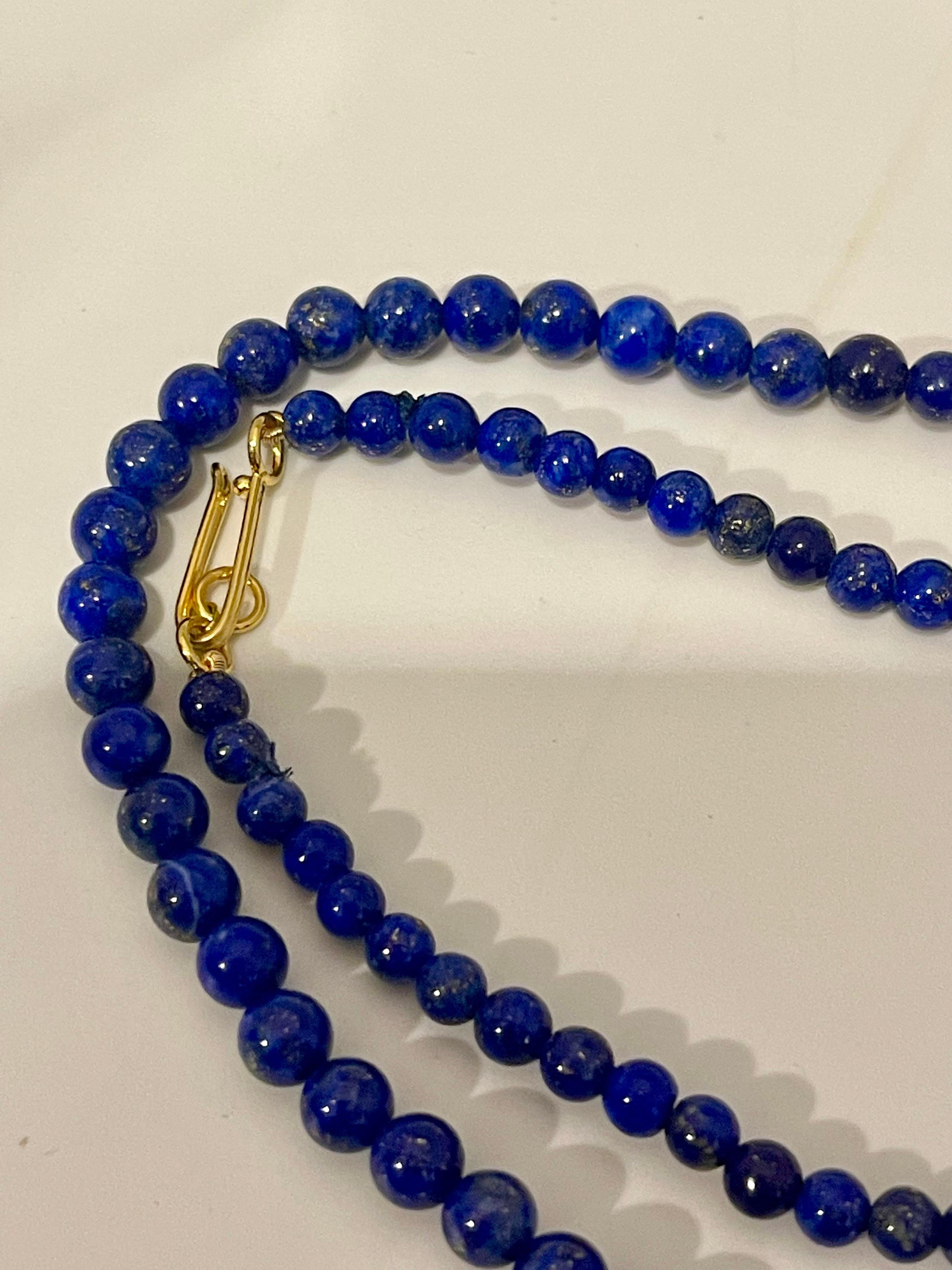 Vintage Lapis Lazuli Single Strand Necklace With 14 Karat Yellow Gold heavy yellow gold Hook clasp
This marvelous vintage Lapis Lazuli Graduating necklace features 1 row of luscious Beads
measuring approximately 5 to 6 mm Beads
strand is 20 inches