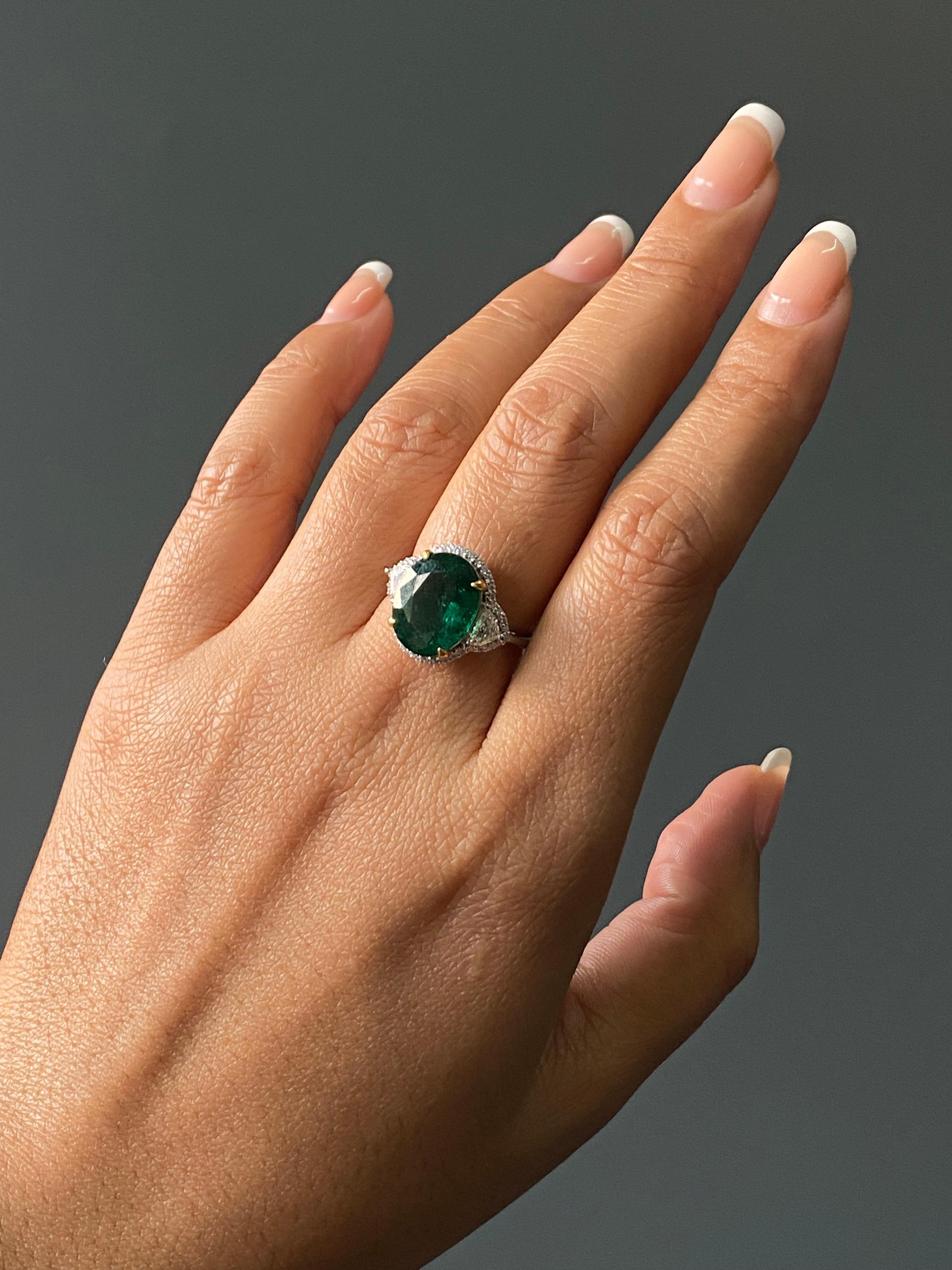 The centerpiece features a rare natural Zambian emerald in an oval cut (13 x 10 mm, 5.16 carats), radiating a deep, vibrant green color . 

People have admired emerald’s green for thousands of years. Emeralds have always been associated with the