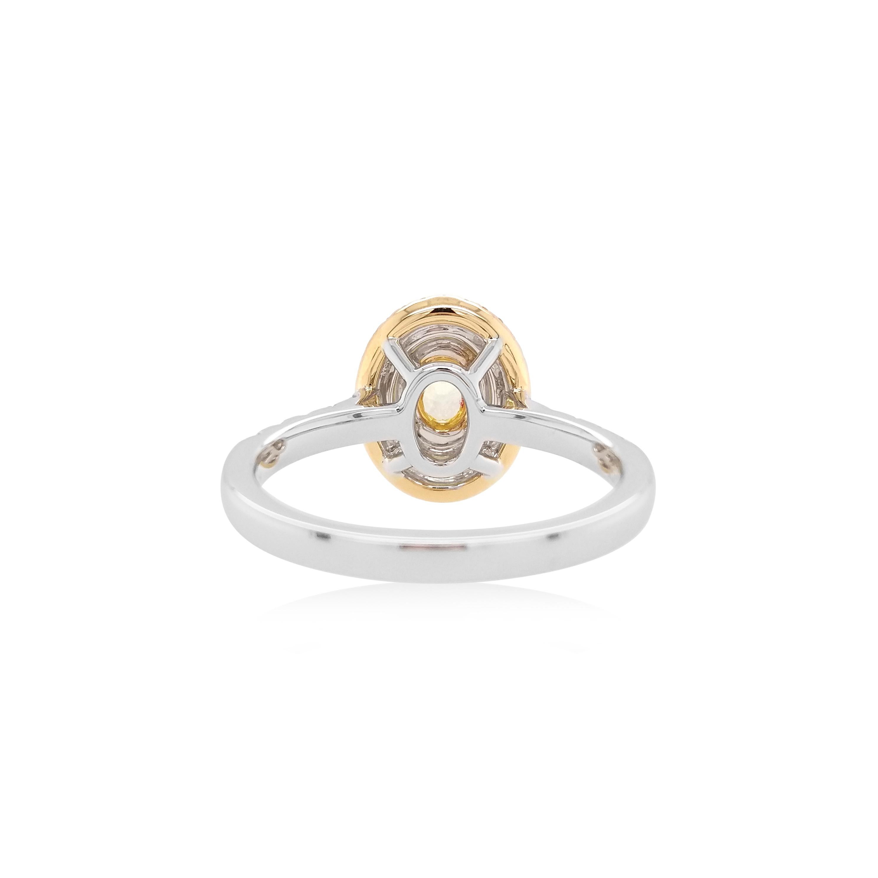 Natural Yellow Diamond Studded Ring with alternating Yellow diamond and white diamond halos. The ring is an exemplary piece set in a rare Fancy Intense yellow diamond showcasing elegance and beauty
-	Natural Fancy Intense Yellow diamond, 0.198