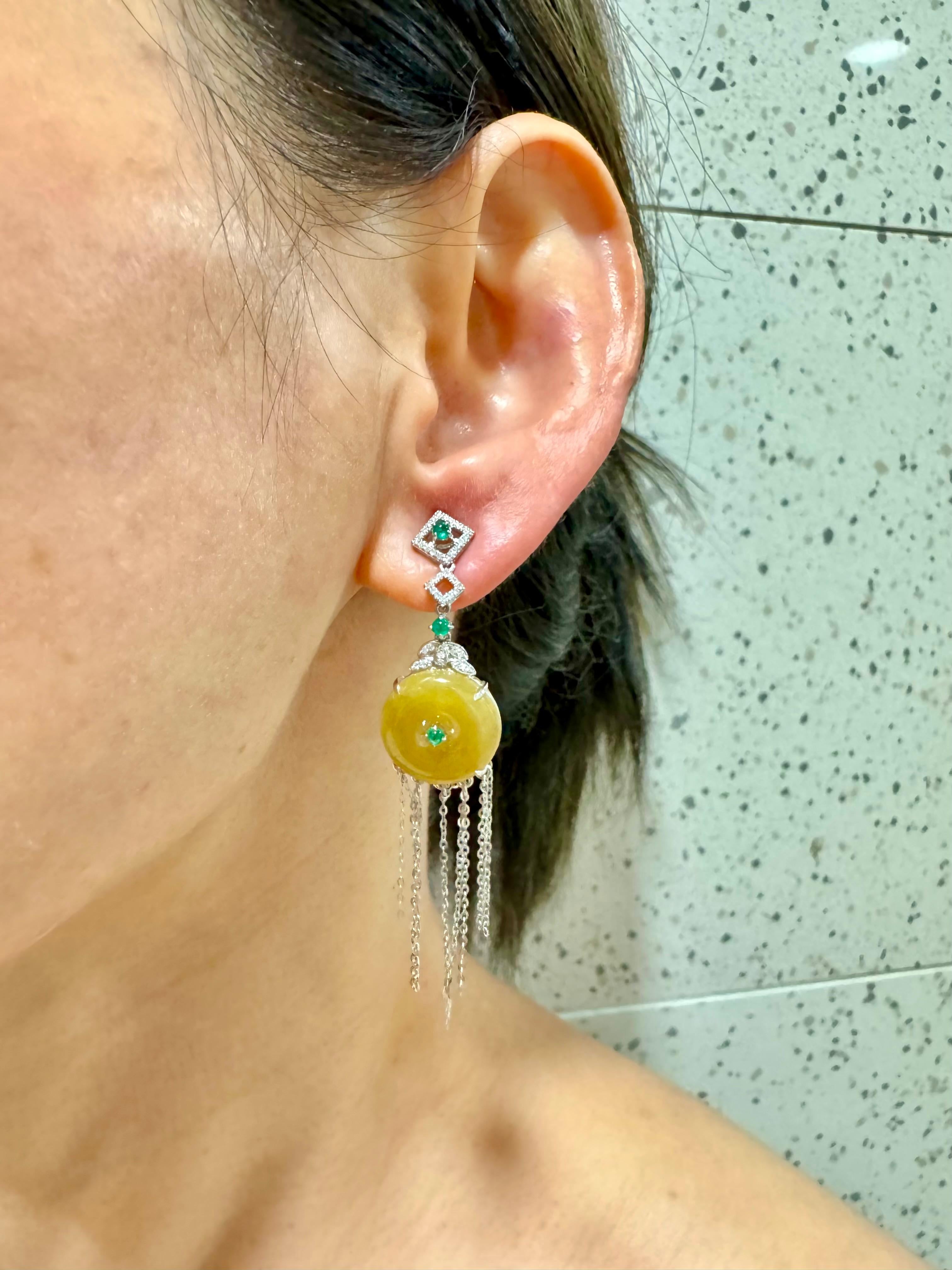 This pair of butterscotch jade earrings are located in the USA and can be shipped domestically within USA. Please check out the HD video! Here is a nice pair of yellow Jade dangle earrings. The diameter of the jade disc is about 14.6mm each. The